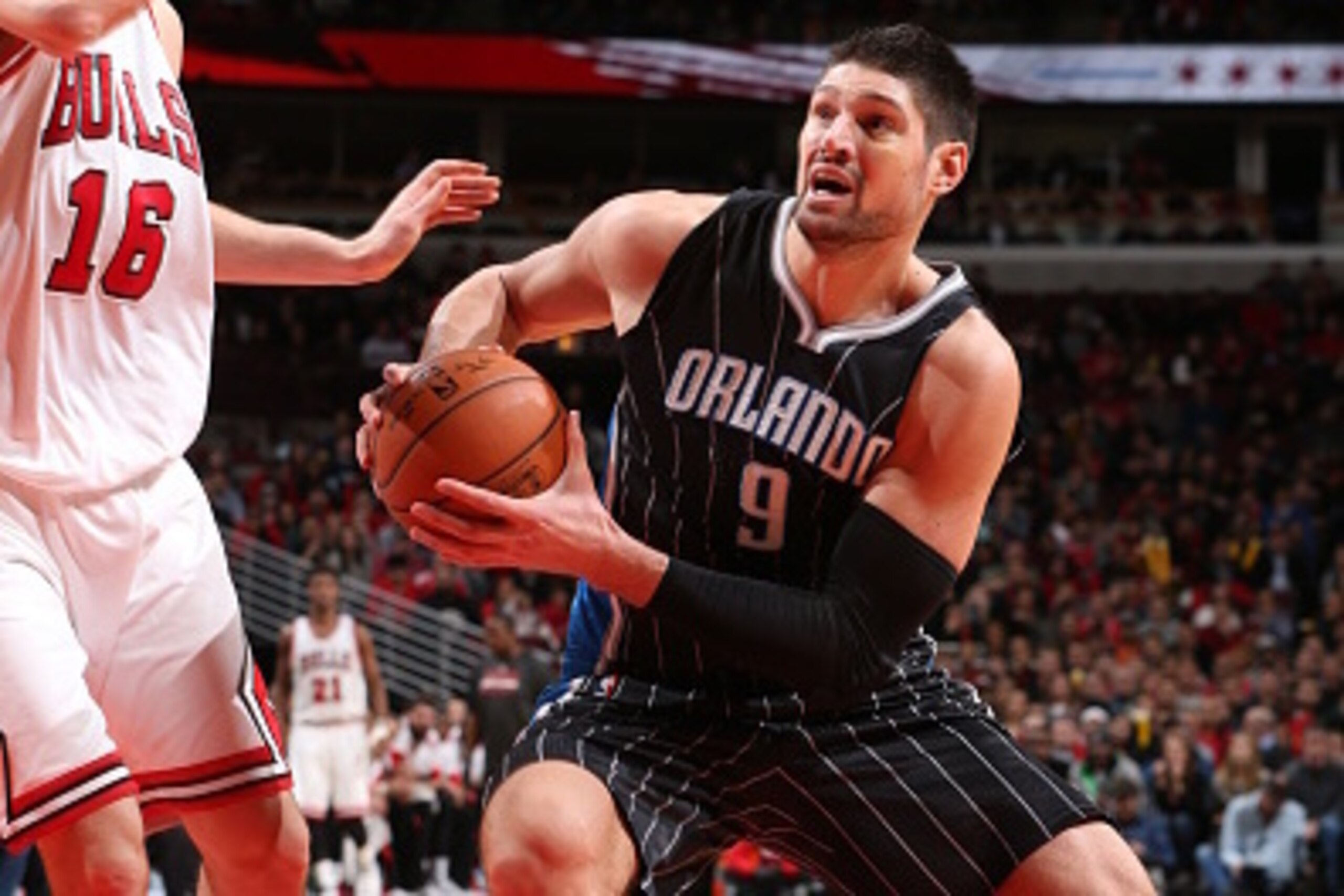 CHICAGO, IL - JANUARY 12:  Nikola Vucevic #9 of the Orlando Magic drives to the basket against the Chicago Bulls on January 12, 2015 at the United Center in Chicago, Illinois. NOTE TO USER: User expressly acknowledges and agrees that, by downloading and o