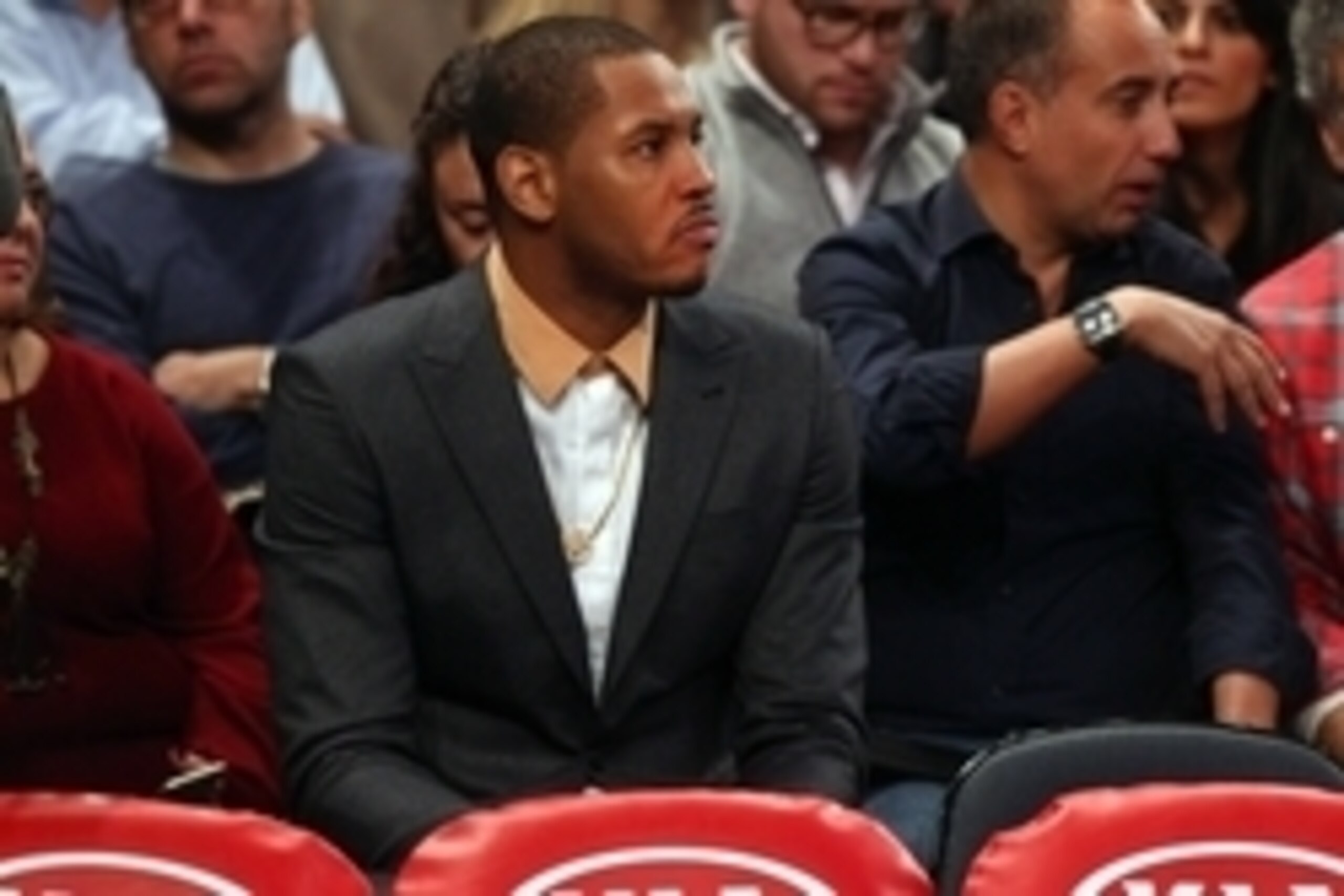 Jan 4, 2015; New York, NY, USA; New York Knicks injured small forward Carmelo Anthony (7) watches from the second row during a time out during the first quarter against the Milwaukee Bucks at Madison Square Garden. Mandatory Credit: Brad Penner-USA TODAY 