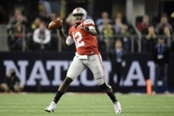 oJan 12, 2015; Arlington, TX, USA; Ohio State Buckeyes quarterback Cardale Jones (12) throws a pass against the Oregon Ducks in the second quarter in the 2015 CFP National Championship Game at AT&T Stadium. Mandatory Credit: John David Mercer-USA TODAY Sp