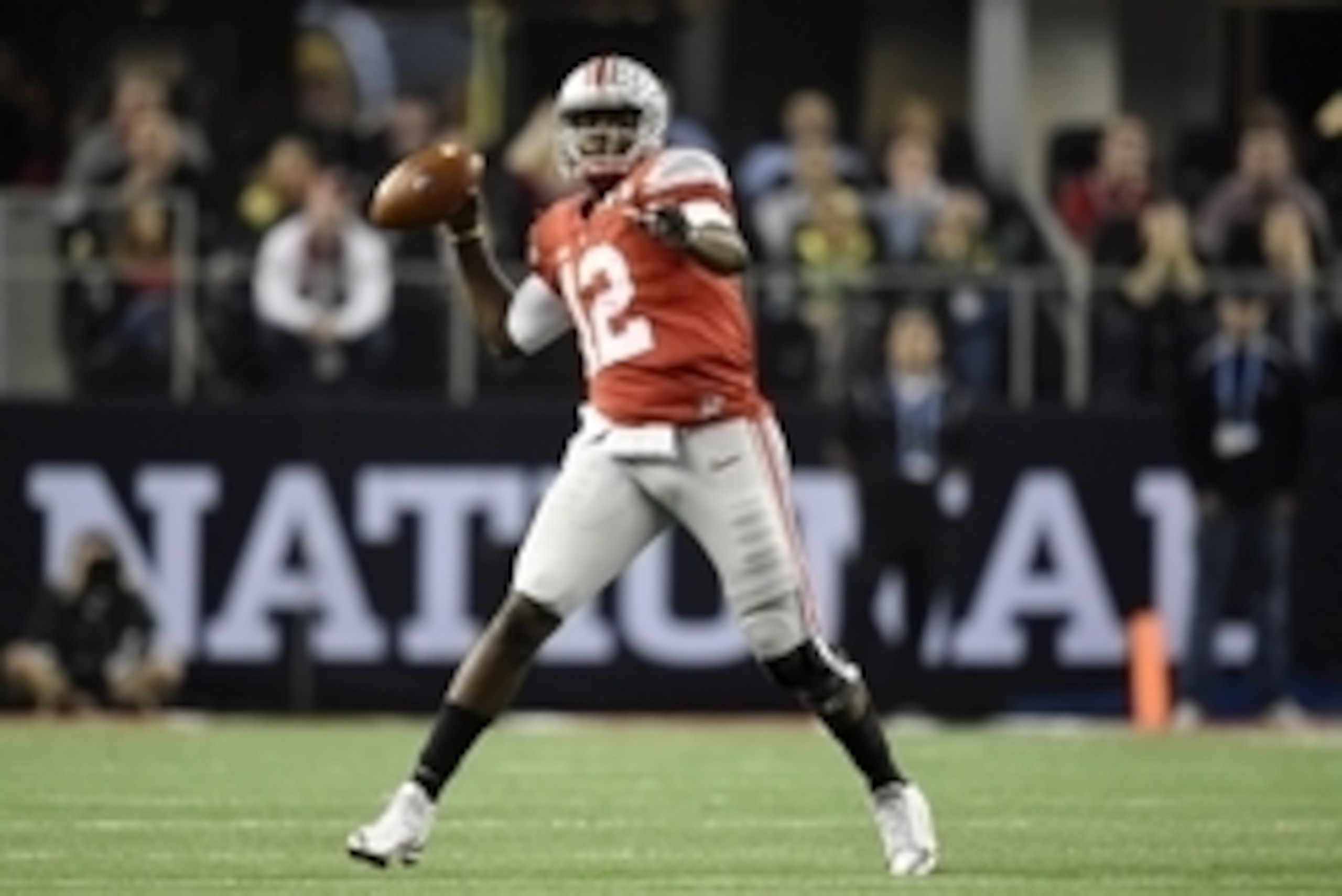 oJan 12, 2015; Arlington, TX, USA; Ohio State Buckeyes quarterback Cardale Jones (12) throws a pass against the Oregon Ducks in the second quarter in the 2015 CFP National Championship Game at AT&T Stadium. Mandatory Credit: John David Mercer-USA TODAY Sp