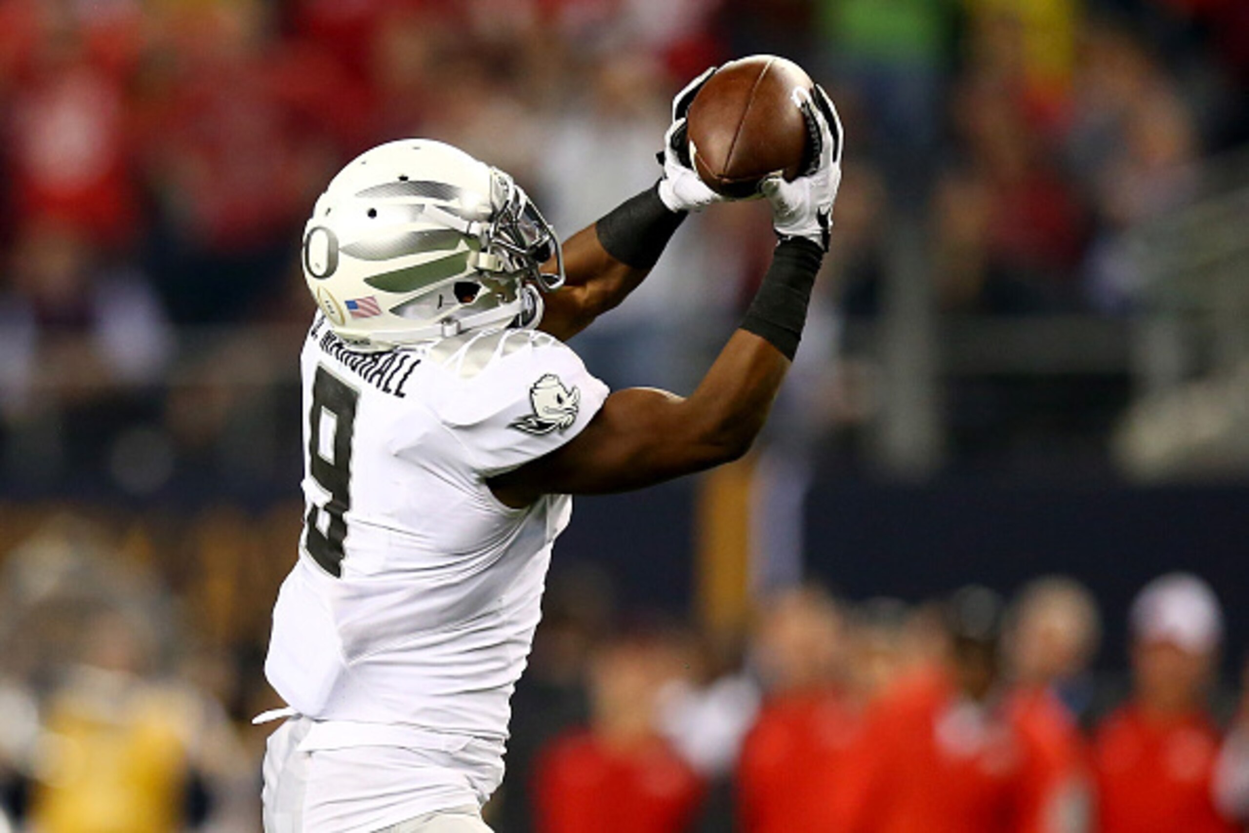 ARLINGTON, TX - JANUARY 12:  Running back Byron Marshall #9 of the Oregon Ducks catches a pass to score a 70 yard touchdown in the third quarter against the Ohio State Buckeyes during the College Football Playoff National Championship Game at AT&T Stadium