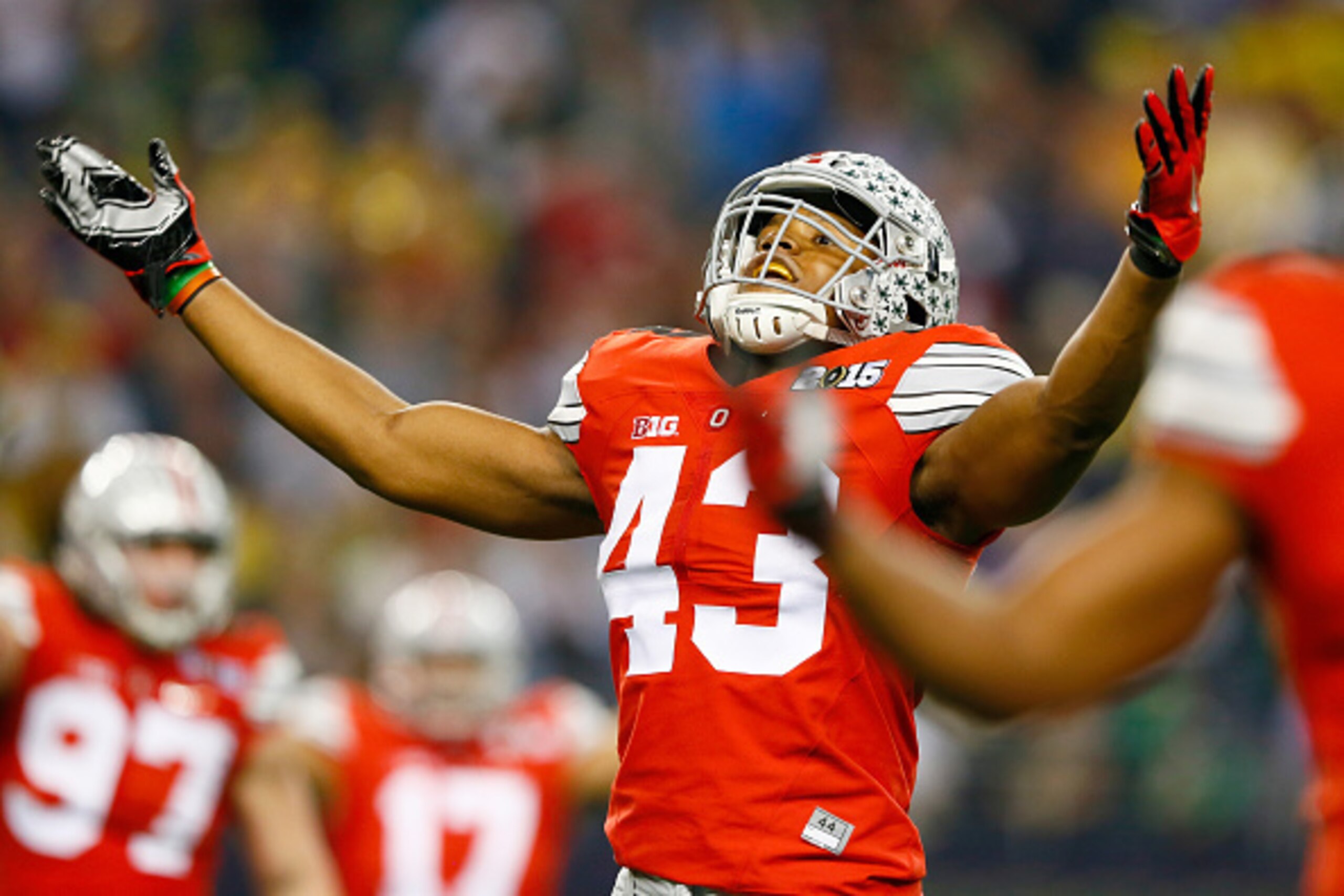 ARLINGTON, TX - JANUARY 12:  Linebacker Darron Lee #43 of the Ohio State Buckeyes celebrates a play in the fourth quarter against the Oregon Ducks during the College Football Playoff National Championship Game at AT&T Stadium on January 12, 2015 in Arling