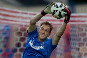 MADRID, SPAIN - AUGUST 30:  Goalkeeper Jan Oblak of Atletico de Madrid stops the ball during his warming up prior to start the La Liga match between Club Atletico de Madrid and SD Eibar at Vicente Calderon Stadium on August 30, 2014 in Madrid, Spain.  (Ph