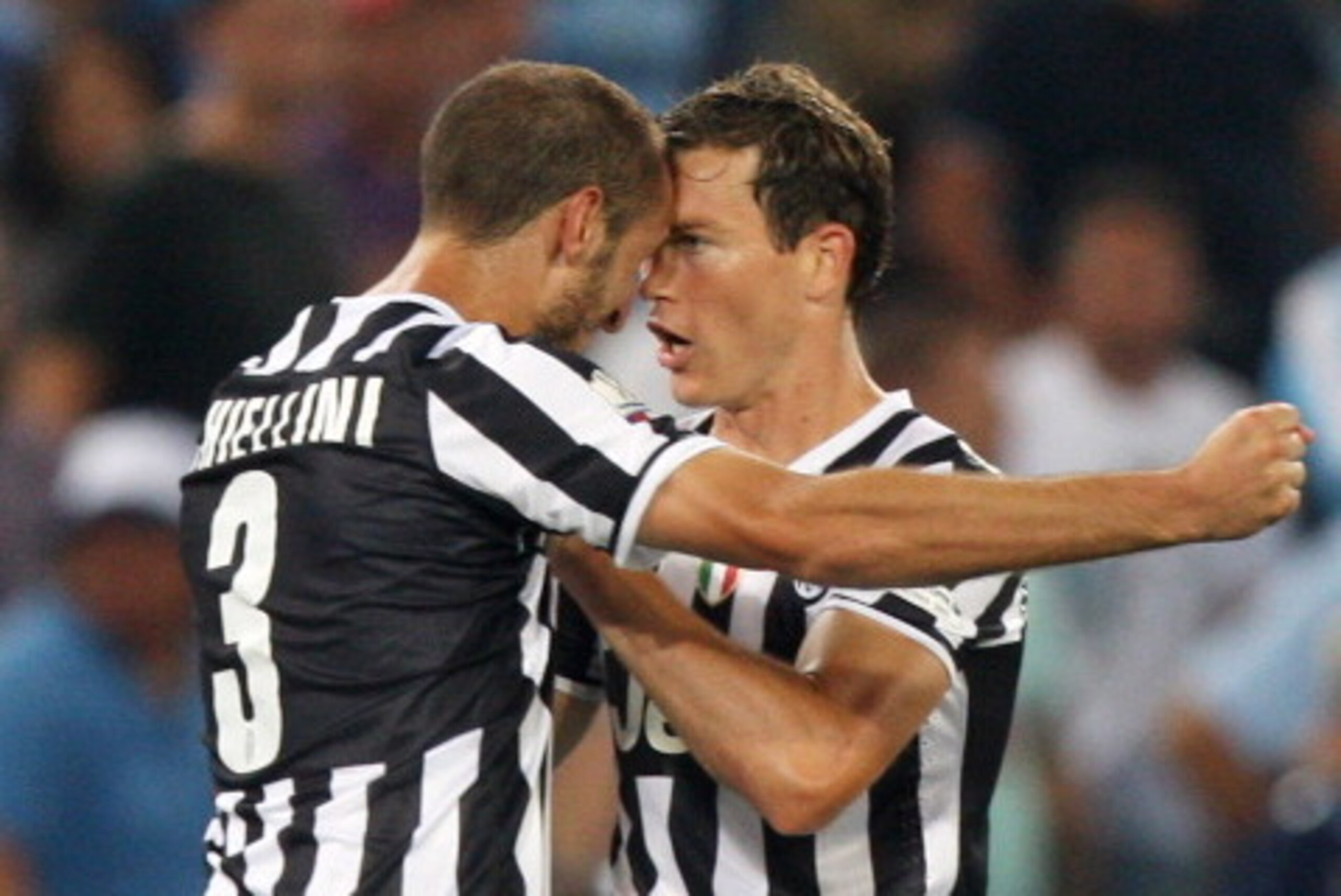 ROME, ITALY - AUGUST 18:  Giorgio Chiellini (L) with his teammate Stephan Lichtsteiner of FC Juventus celebrates after scoring the second goal during the TIM Supercup match between SS Lazio and FC Juventus at Olimpico Stadium on August 18, 2013 in Rome, I