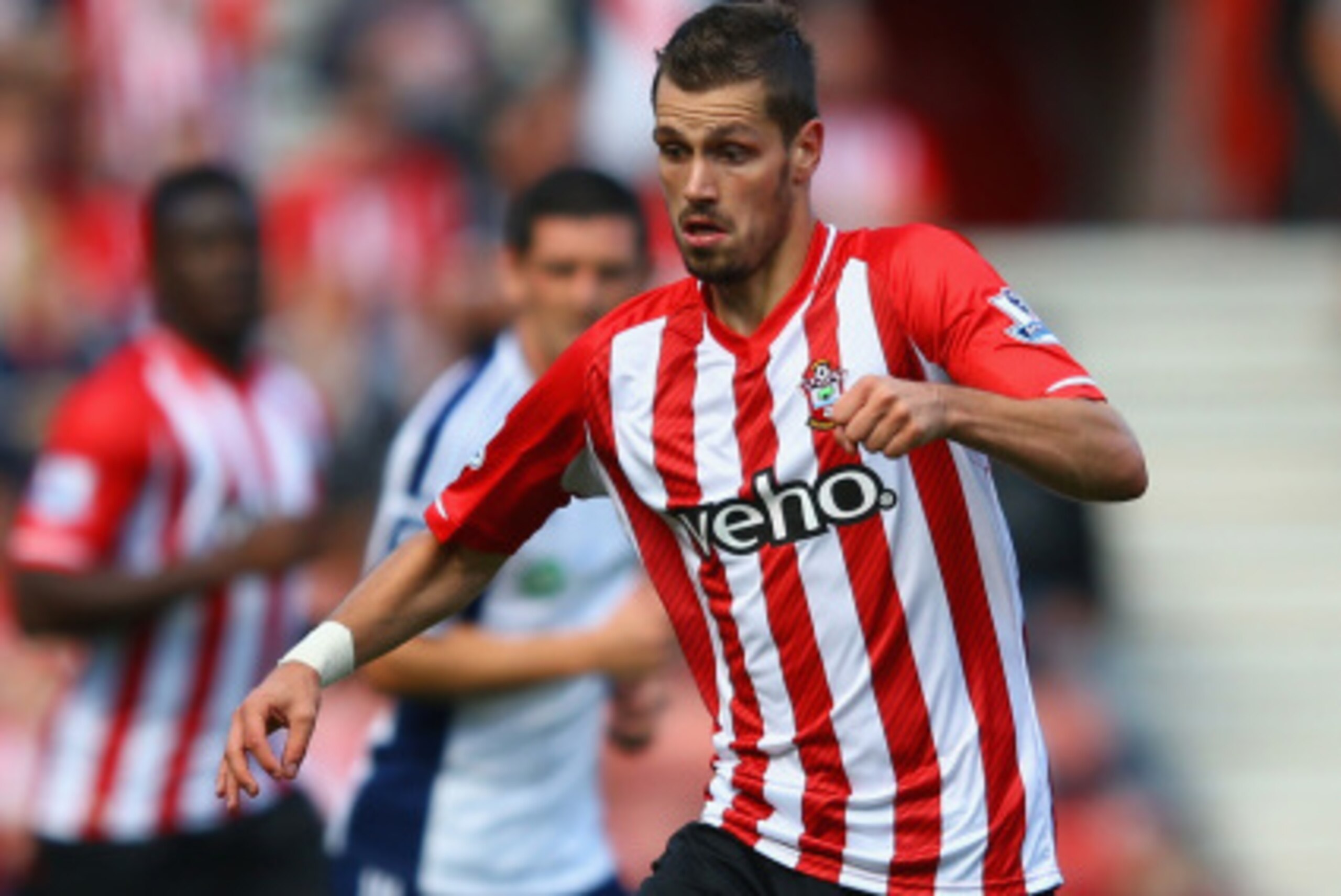 SOUTHAMPTON, ENGLAND - AUGUST 23:  Morgan Schneiderlin of Southampton on the ball during the Barclays Premier League match between Southampton and West Bromwich Albion at St Mary's Stadium on August 23, 2014 in Southampton, England.  (Photo by Richard Hea