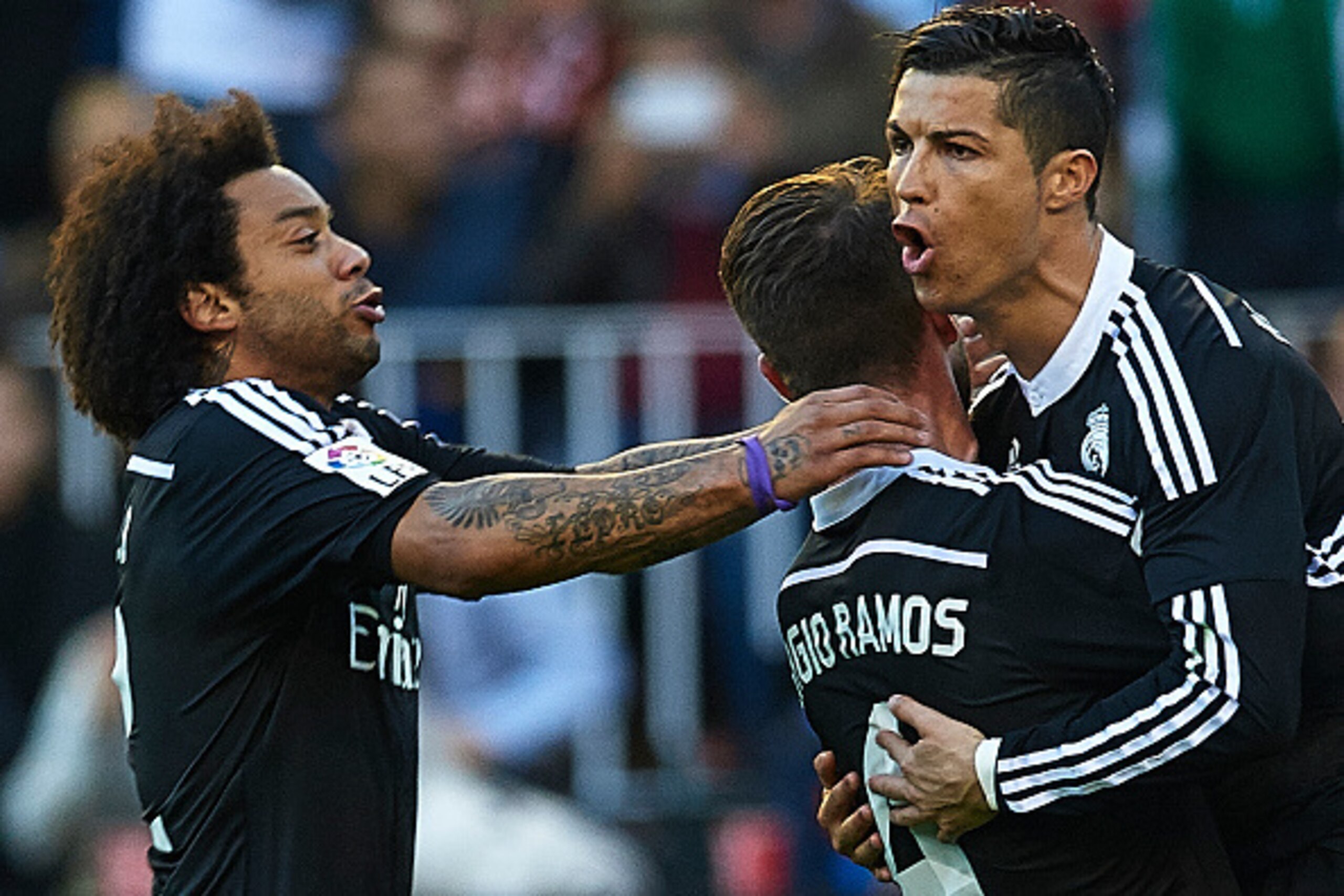 VALENCIA, SPAIN - JANUARY 04:  Cristiano Ronaldo (R) of Real Madrid celebrates after scoring with his teamates Sergio Ramos and Marcelo (L) during the La Liga match between Valencia CF and Real Madrid CF at Estadi de Mestalla on January 4, 2015 in Valenci
