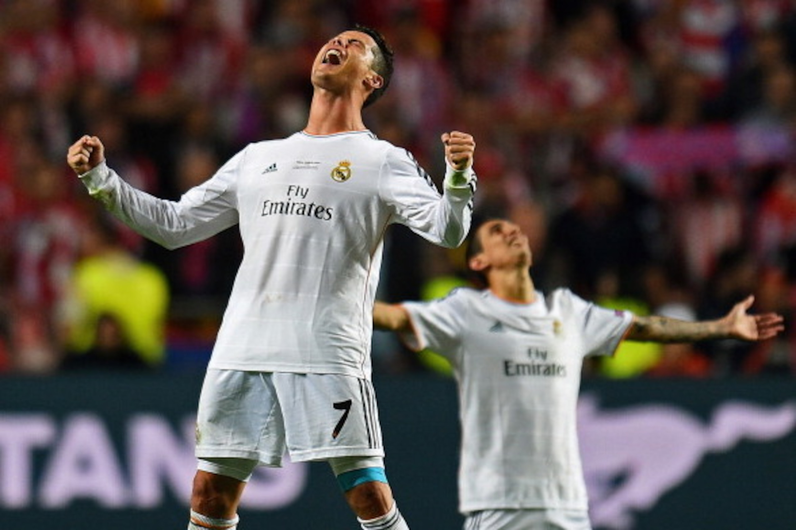 LISBON, PORTUGAL - MAY 24:  (Alternate crop of image #493642573) Cristiano Ronaldo of Real Madrid celebrates victory with Angel De Maria (R) after the UEFA Champions League Final between Real Madrid and Atletico de Madrid at Estadio da Luz on May 24, 2014