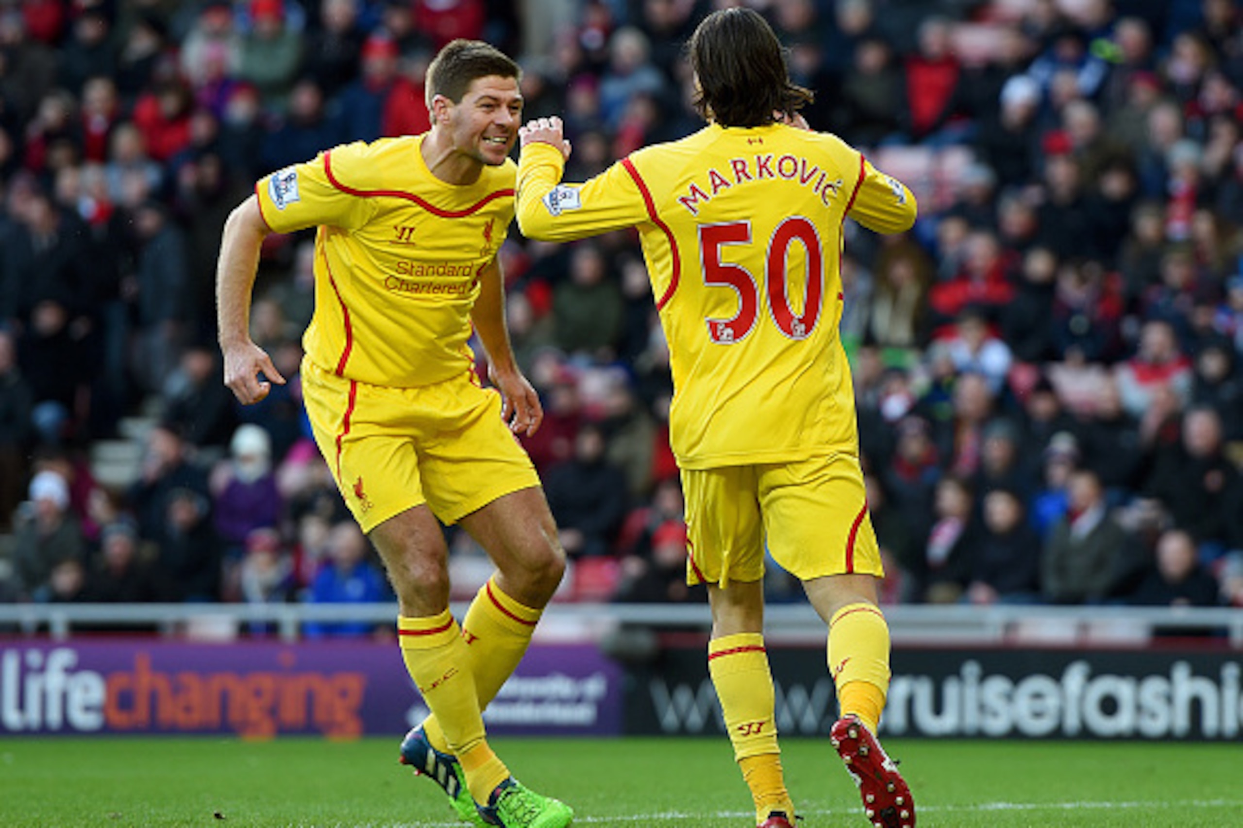 SUNDERLAND, ENGLAND - JANUARY 10:  Lazar Markovic of Liverpool celebrates scoring the opening goal with Steven Gerrard during the Barclays Premier League match between Sunderland and Liverpool at Stadium of Light on January 10, 2015 in Sunderland, England