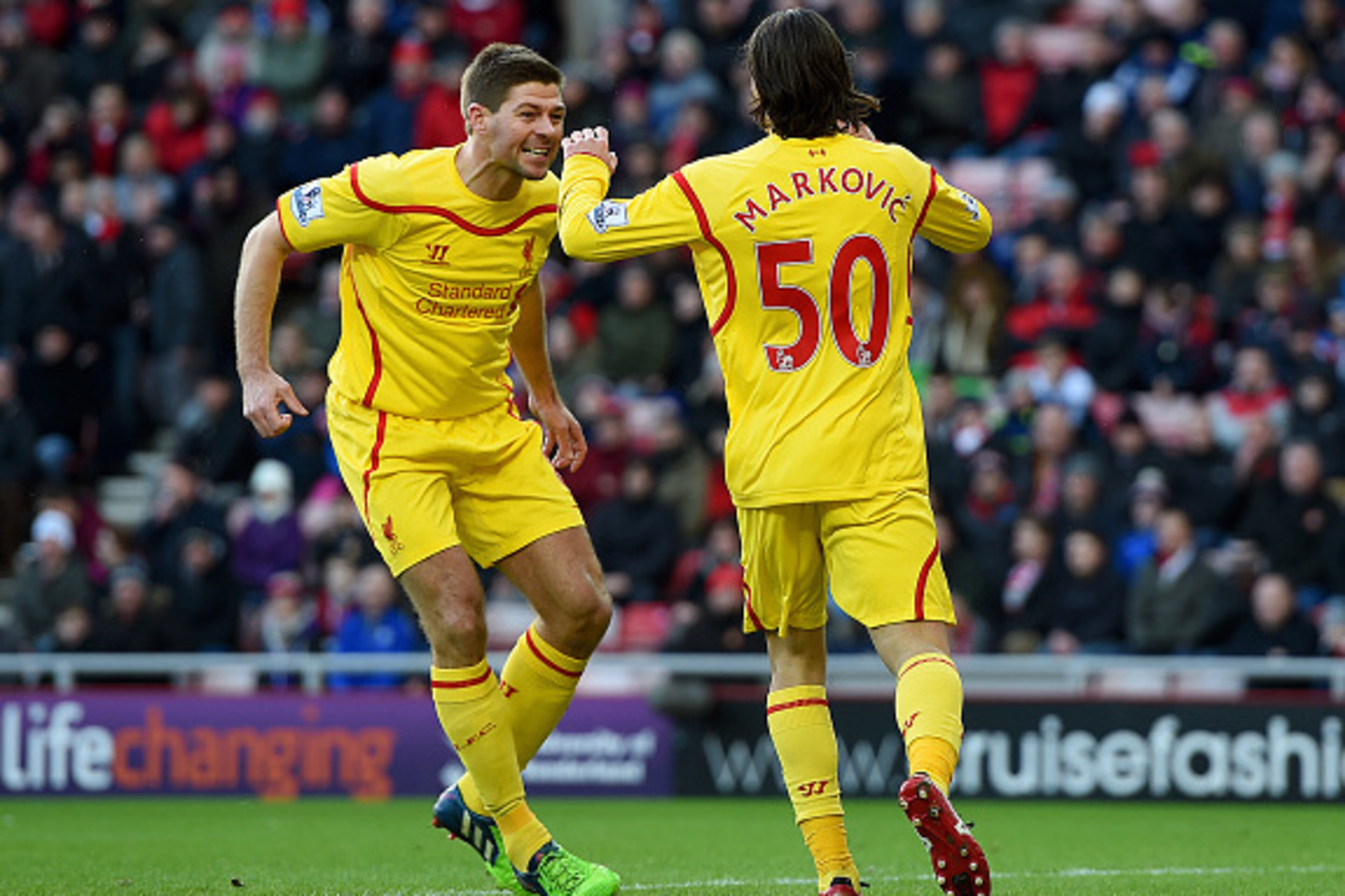 SUNDERLAND, ENGLAND - JANUARY 10:  Lazar Markovic of Liverpool celebrates scoring the opening goal with Steven Gerrard during the Barclays Premier League match between Sunderland and Liverpool at Stadium of Light on January 10, 2015 in Sunderland, England
