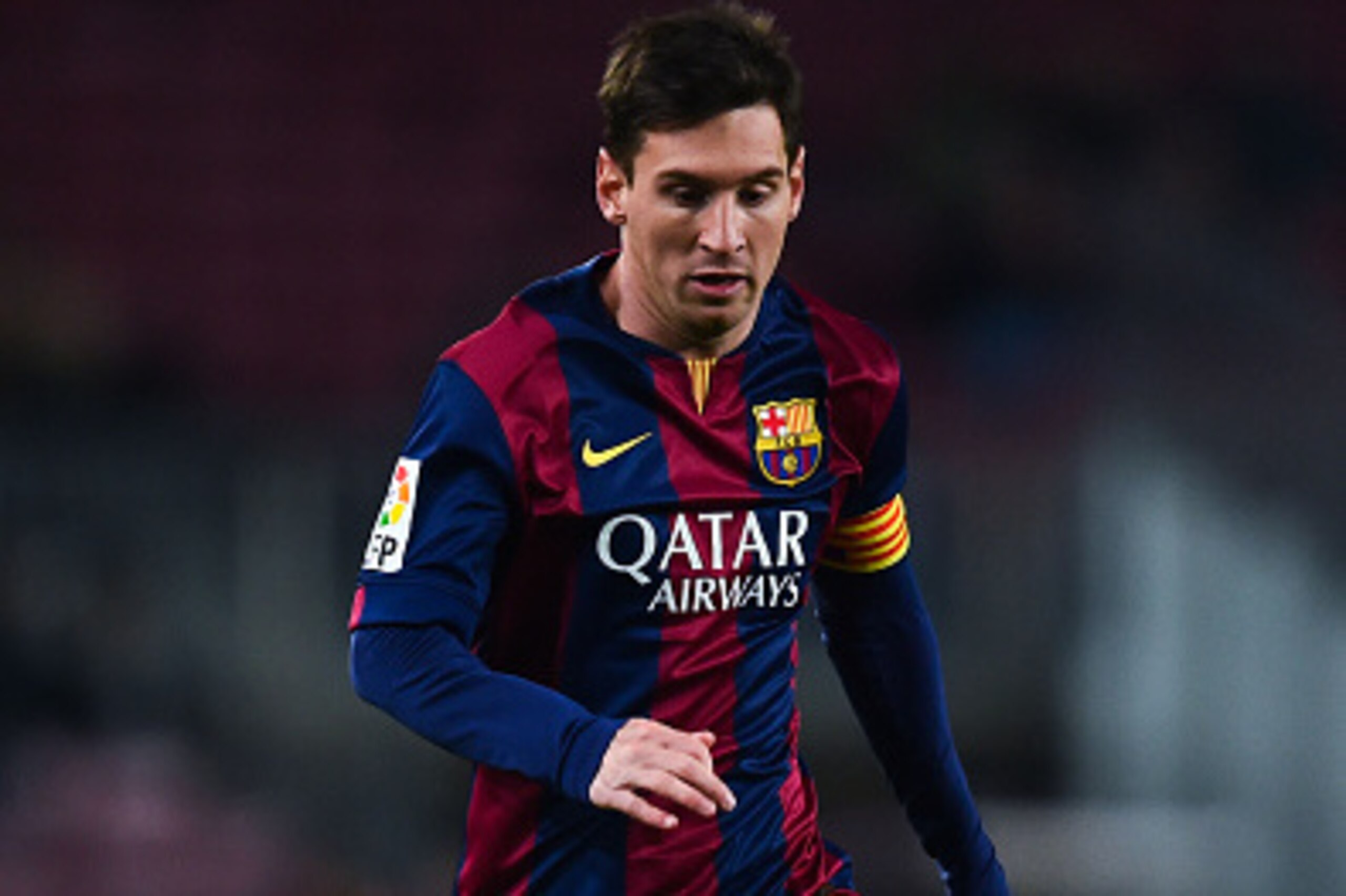BARCELONA, SPAIN - JANUARY 08:  Lionel Messi of FC Barcelona runs with the ball during the Copa del Rey  Round of 16 First Leg match between FC Barcelona and Elche CF at Camp Nou on January 8, 2015 in Barcelona, Spain.  (Photo by David Ramos/Getty Images)