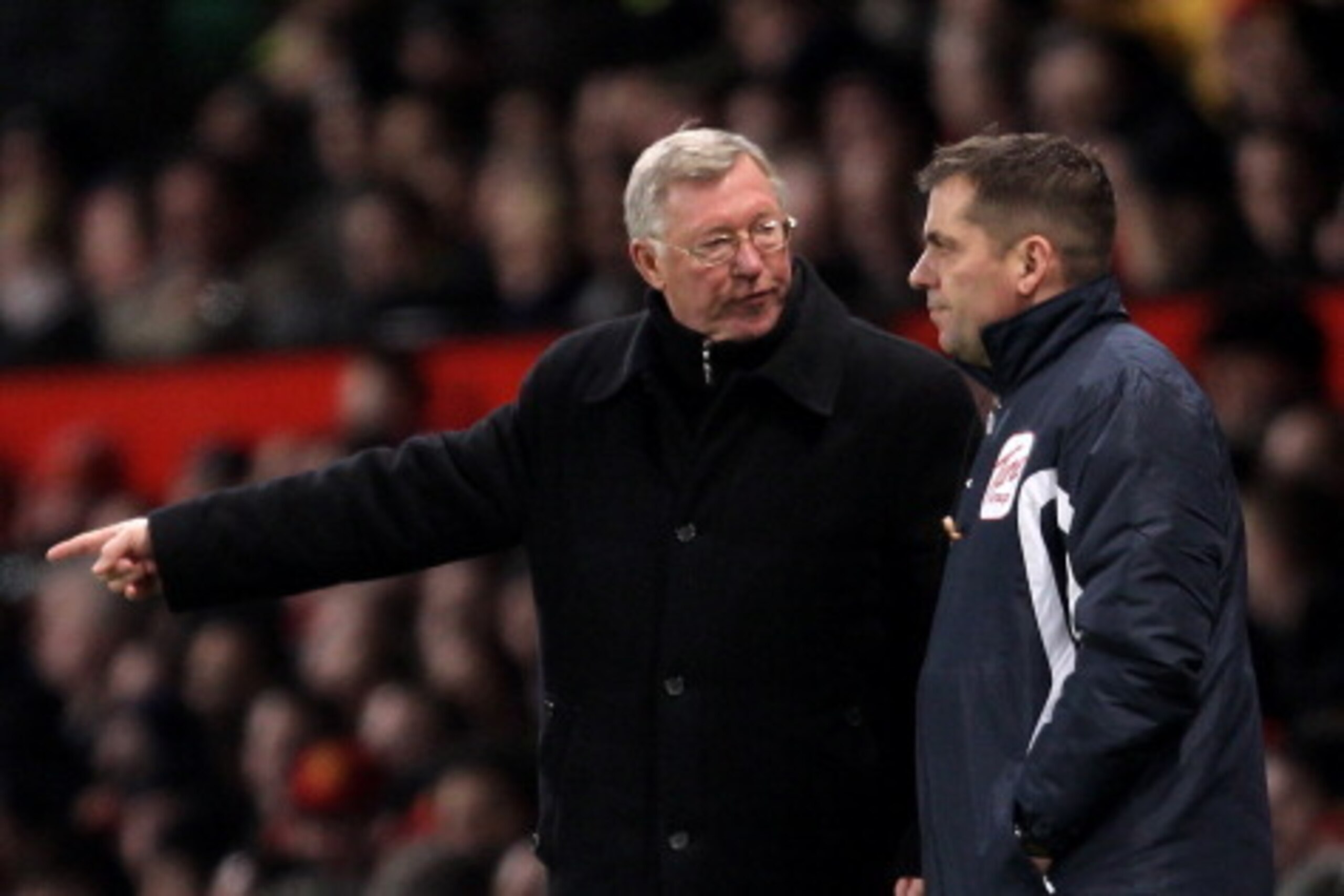 MANCHESTER, ENGLAND - DECEMBER 13:  Manchester United Manager Sir Alex Ferguson protests to Fourth Official Phil Dowd during the Barclays Premier League match between Manchester United and Arsenal at Old Trafford on December 13, 2010 in Manchester, Englan