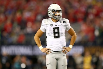 ARLINGTON, TX - JANUARY 12:  Quarterback Marcus Mariota #8 of the Oregon Ducks looks on in the fourth quarter against the Ohio State Buckeyes during the College Football Playoff National Championship Game at AT&T Stadium on January 12, 2015 in Arlington, 