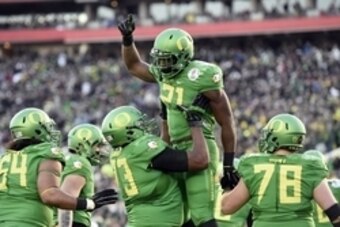 Jan 1, 2015; Pasadena, CA, USA; Oregon Ducks running back Royce Freeman (21) celebrates making a touchdown with teammates during the second half against the Florida State Seminoles in the 2015 Rose Bowl college football game at Rose Bowl. Mandatory Credit