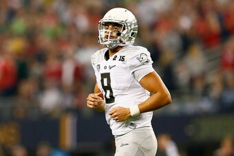 ARLINGTON, TX - JANUARY 12:  Quarterback Marcus Mariota #8 of the Oregon Ducks looks on in the first half against the Ohio State Buckeyes during the College Football Playoff National Championship Game at AT&T Stadium on January 12, 2015 in Arlington, Texa