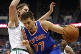 Oct 8, 2014; Hartford, CT, USA; New York Knicks center Andrea Bargnani (77) drives the ball against Boston Celtics center Kelly Olynyk (41) in the first half at XL Center. Mandatory Credit: David Butler II-USA TODAY Sports