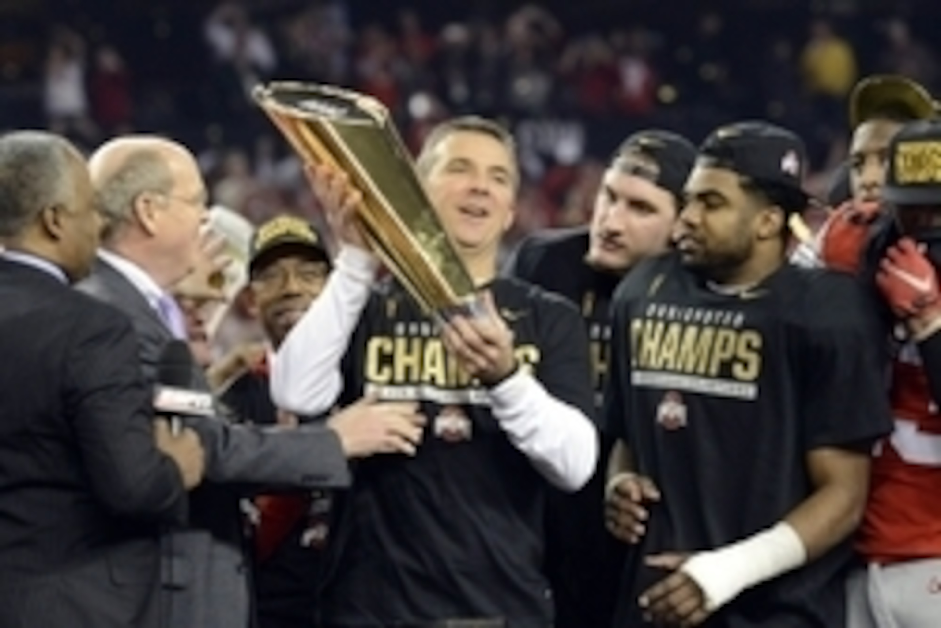 Jan 12, 2015; Arlington, TX, USA; Ohio State Buckeyes head coach Urban Meyer celebrates with the college football championship trophy after beating the Oregon Ducks in the 2015 CFP National Championship Game at AT&T Stadium. Mandatory Credit: Tommy Gillig Jan 12, 2015; Arlington, TX, USA; Ohio State Buckeyes head coach Urban Meyer celebrates with the college football championship trophy after beating the Oregon Ducks in the 2015 CFP National Championship Game at AT&T Stadium. Mandatory Credit: Tommy Gillig