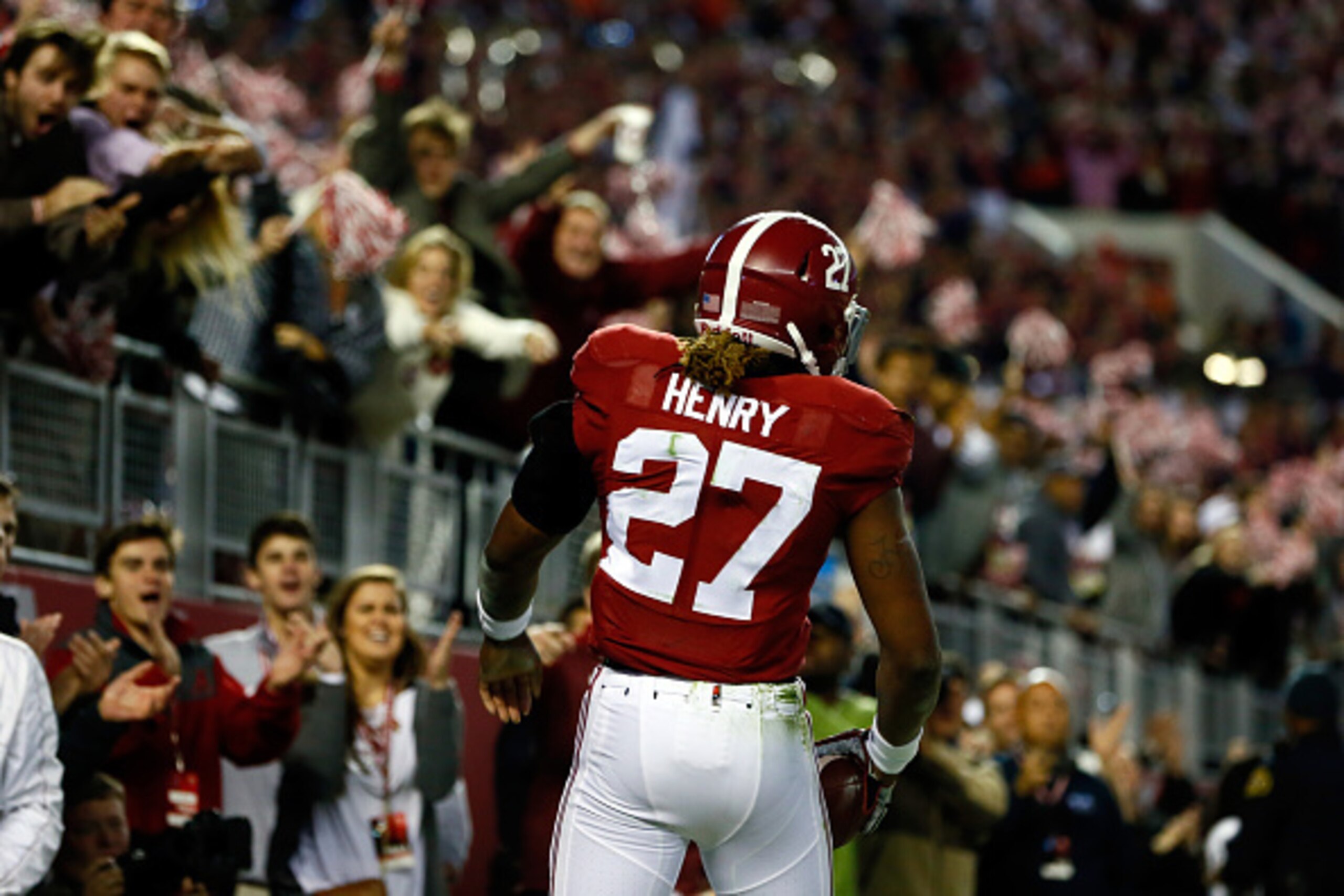 TUSCALOOSA, AL - NOVEMBER 29:  Derrick Henry #27 of the Alabama Crimson Tide celebrates in the end zone after scoring a 25 yard touchdown in the fourth quarter against the Auburn Tigers during the Iron Bowl at Bryant-Denny Stadium on November 29, 2014 in 