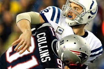 FOXBORO, MA - JANUARY 11:   Andrew Luck #12 of the Indianapolis Colts gets tackled by  Jamie Collins #91 of the New England Patriots during the AFC Divisional Playoff game at Gillette Stadium on January 11, 2014 in Foxboro, Massachusetts.  (Photo by Jim R