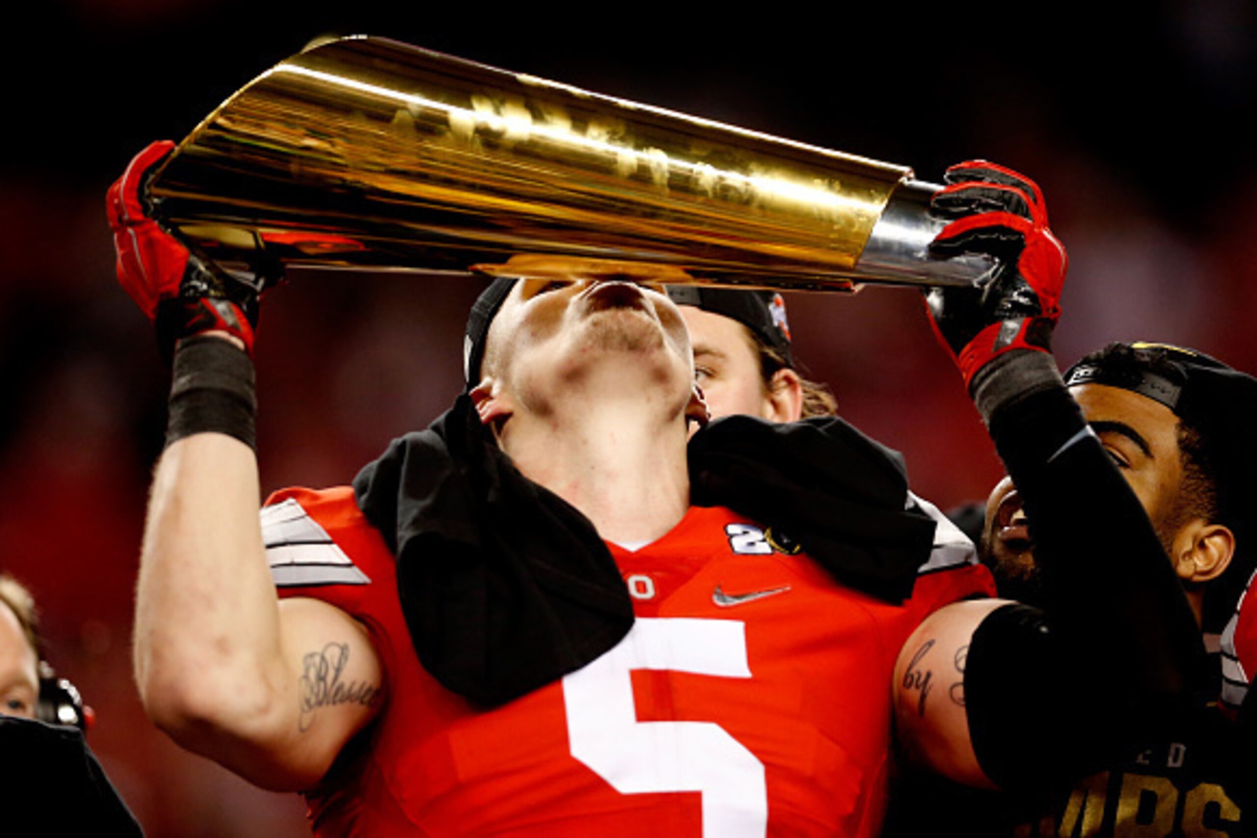 ARLINGTON, TX - JANUARY 12:  Linebacker Raekwon McMillan #5 of the Ohio State Buckeyes celebrates with the trophy after defeating the Oregon Ducks 42 to 20 in the College Football Playoff National Championship Game at AT&T Stadium on January 12, 2015 in A