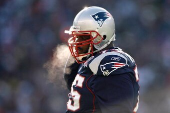 FOXBORO, MA - JANUARY 10:  Vince Wilfork #75 of the New England Patriots adjusts his chin strap against the Baltimore Ravens during the 2010 AFC wild-card playoff game at Gillette Stadium on January 10, 2010 in Foxboro, Massachusetts. The Ravens won 33-14