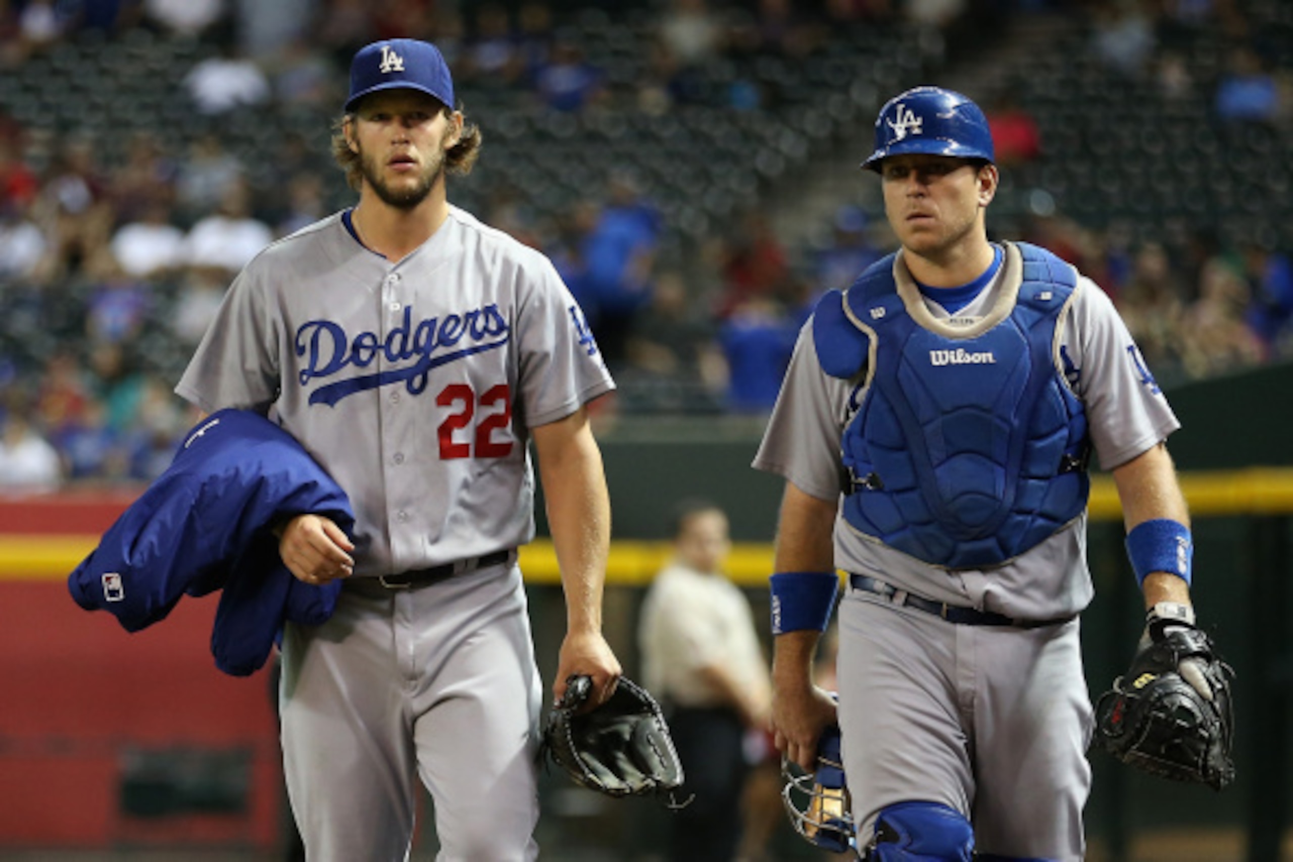PHOENIX, AZ - AUGUST 27:  Starting pitcher Clayton Kershaw #22 and catcher A.J. Ellis #17 of the Los Angeles Dodgers walk to the dugout before the MLB game against the Arizona Diamondbacks at Chase Field on August 27, 2014 in Phoenix, Arizona.  (Photo by 