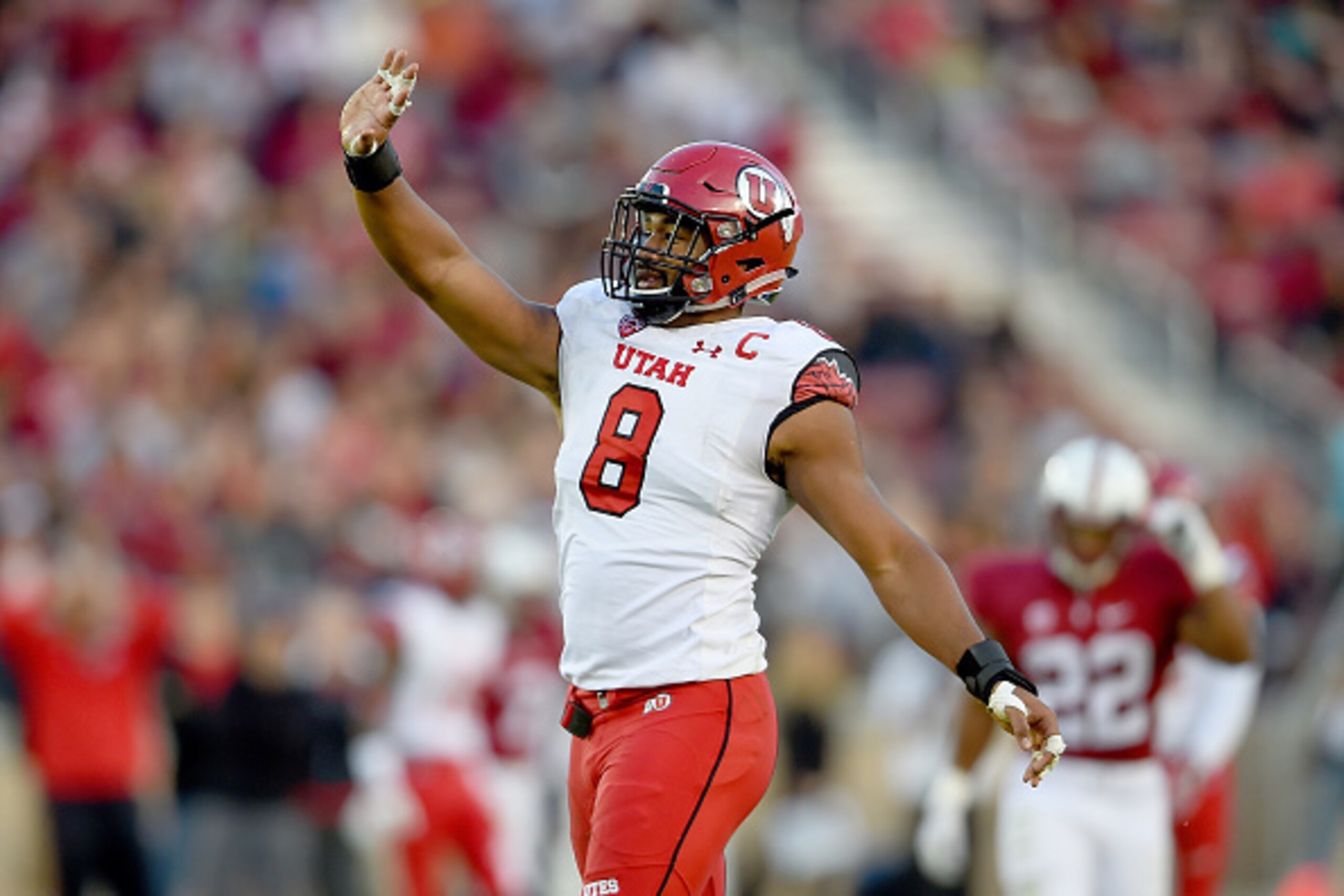 PALO ALTO, CA - NOVEMBER 15:  Nate Orchard #8 of the Utah Utes celebrates after sacking quarterback Kevin Hogan #8 of the Stanford Cardinal in the second quarter at Stanford Stadium on November 15, 2014 in Palo Alto, California.  (Photo by Thearon W. Hend