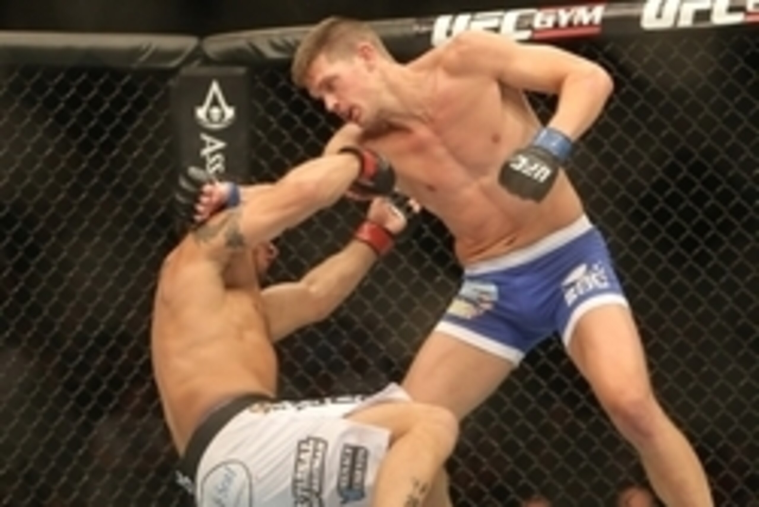 Sep 21, 2013; Toronto, Ontario, CAN; Stephen Thompson (right) knocks down Chris Clements during their Welterweight bout at UFC 165 at the Air Canada Centre. Mandatory Credit: Tom Szczerbowski-USA TODAY Sports