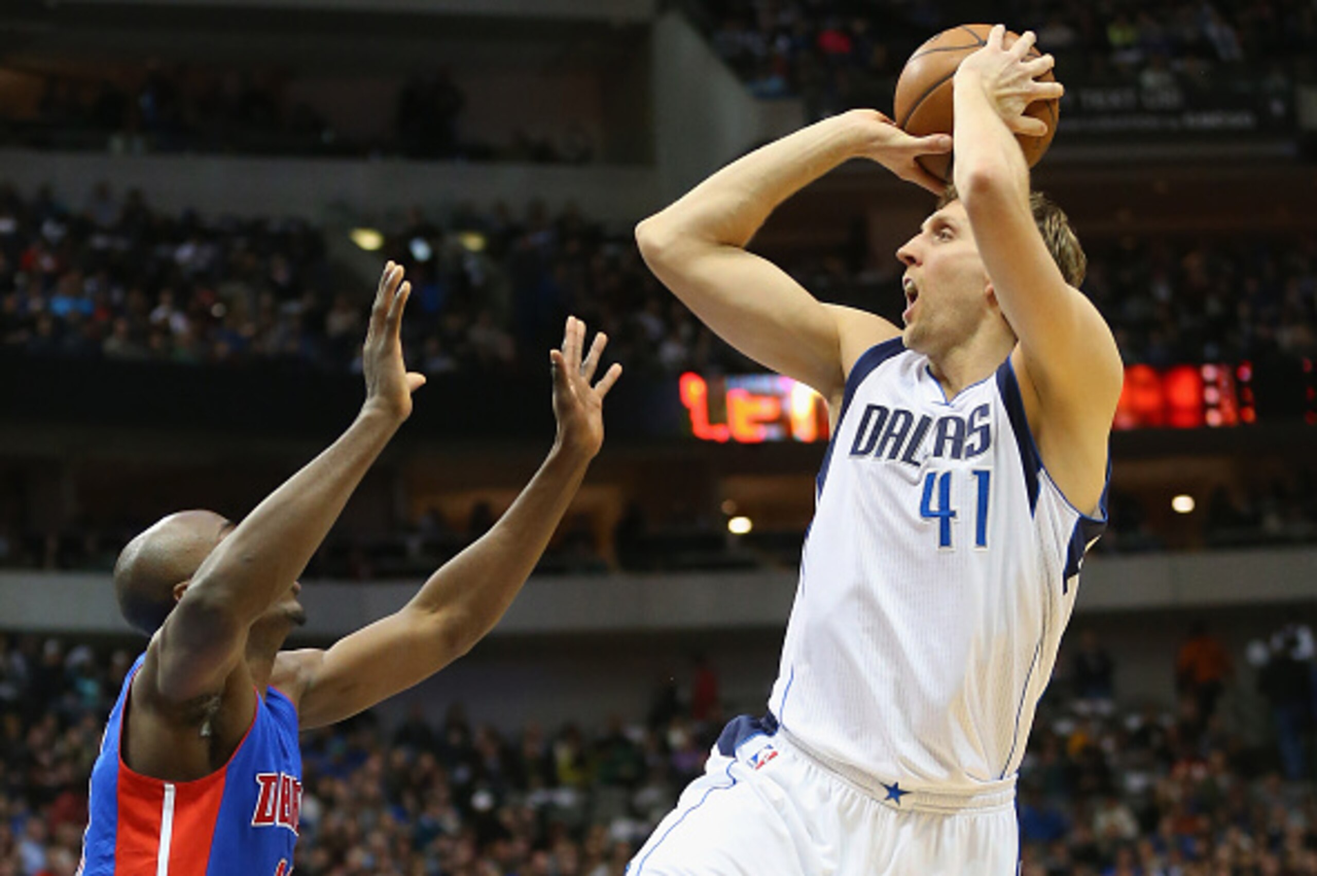 DALLAS, TX - JANUARY 07:  Dirk Nowitzki #41 of the Dallas Mavericks takes a shot against Anthony Tolliver #43 of the Detroit Pistons at American Airlines Center on January 7, 2015 in Dallas, Texas.   NOTE TO USER: User expressly acknowledges and agrees th