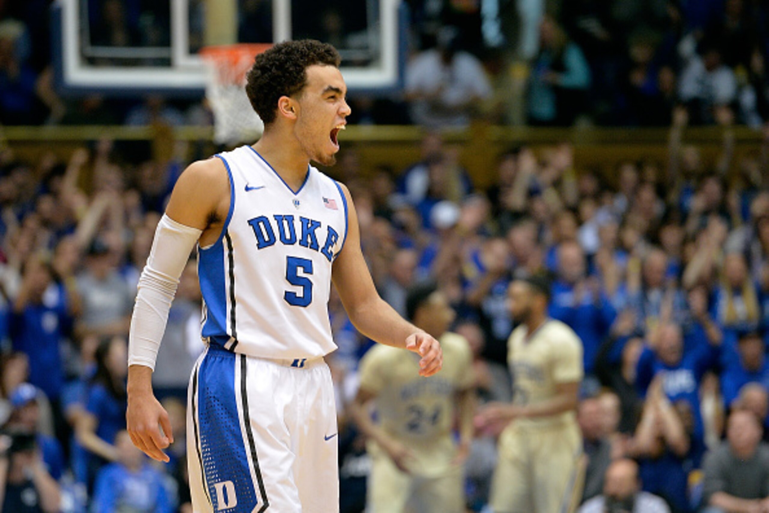 DURHAM, NC - DECEMBER 31: Tyus Jones #5 of the Duke Blue Devils reacts during a win over the Wofford Terriers at Cameron Indoor Stadium on December 31, 2014 in Durham, North Carolina. Duke won 84-55. (Photo by Grant Halverson/Getty Images)