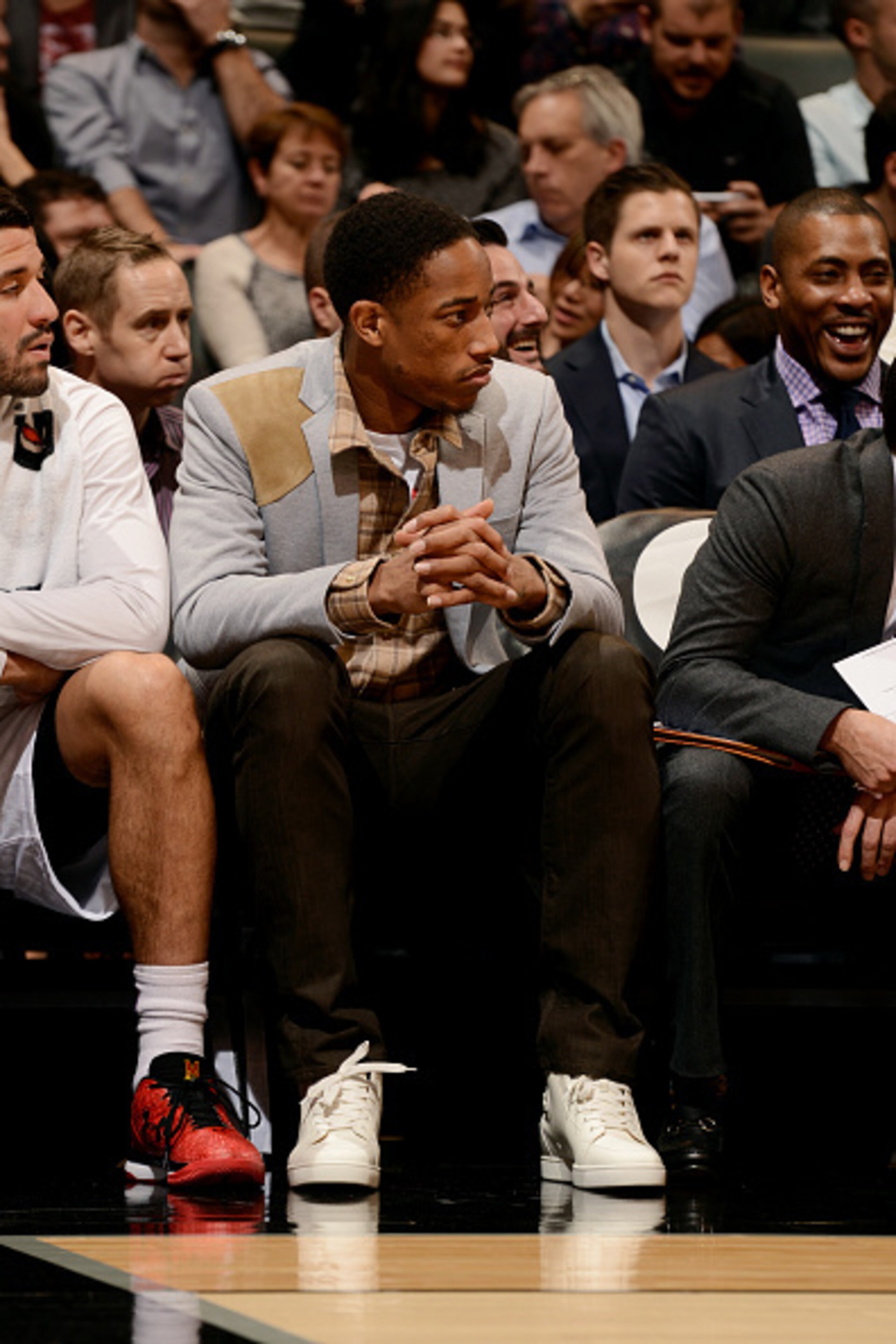 TORONTO, CANADA - December 15: DeMar DeRozan #10 of the Toronto Raptors sits on the sideline during a game against the Orlando Magic on December 15, 2014 at the Air Canada Centre in Toronto, Ontario, Canada.  NOTE TO USER: User expressly acknowledges and 