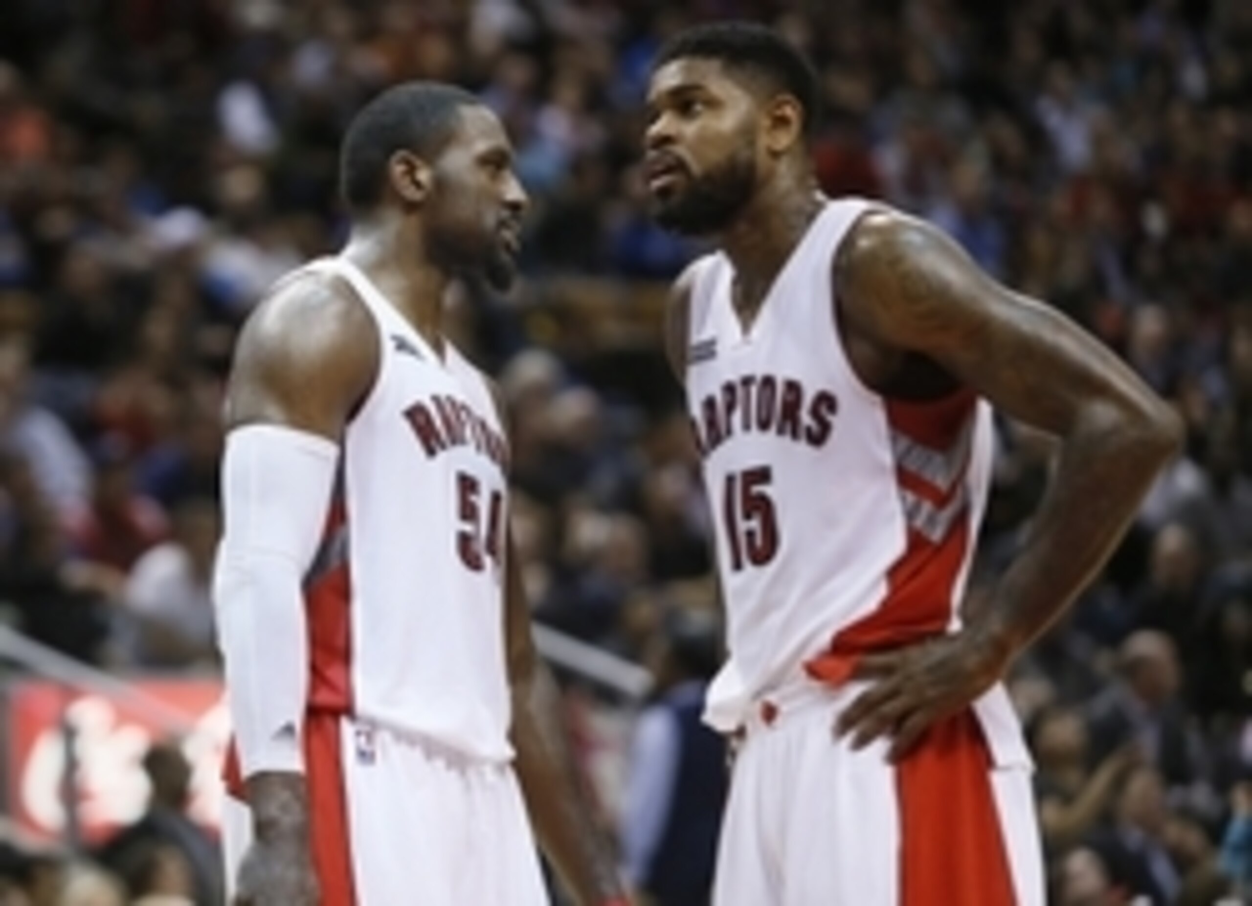 Dec 8, 2014; Toronto, Ontario, CAN; Toronto Raptors forward Patrick Patterson (54) and Toronto Raptors forward Amir Johnson (15) discuss a play during a break in the action against the Denver Nuggets at the Air Canada Centre. Toronto defeated Denver 112-1