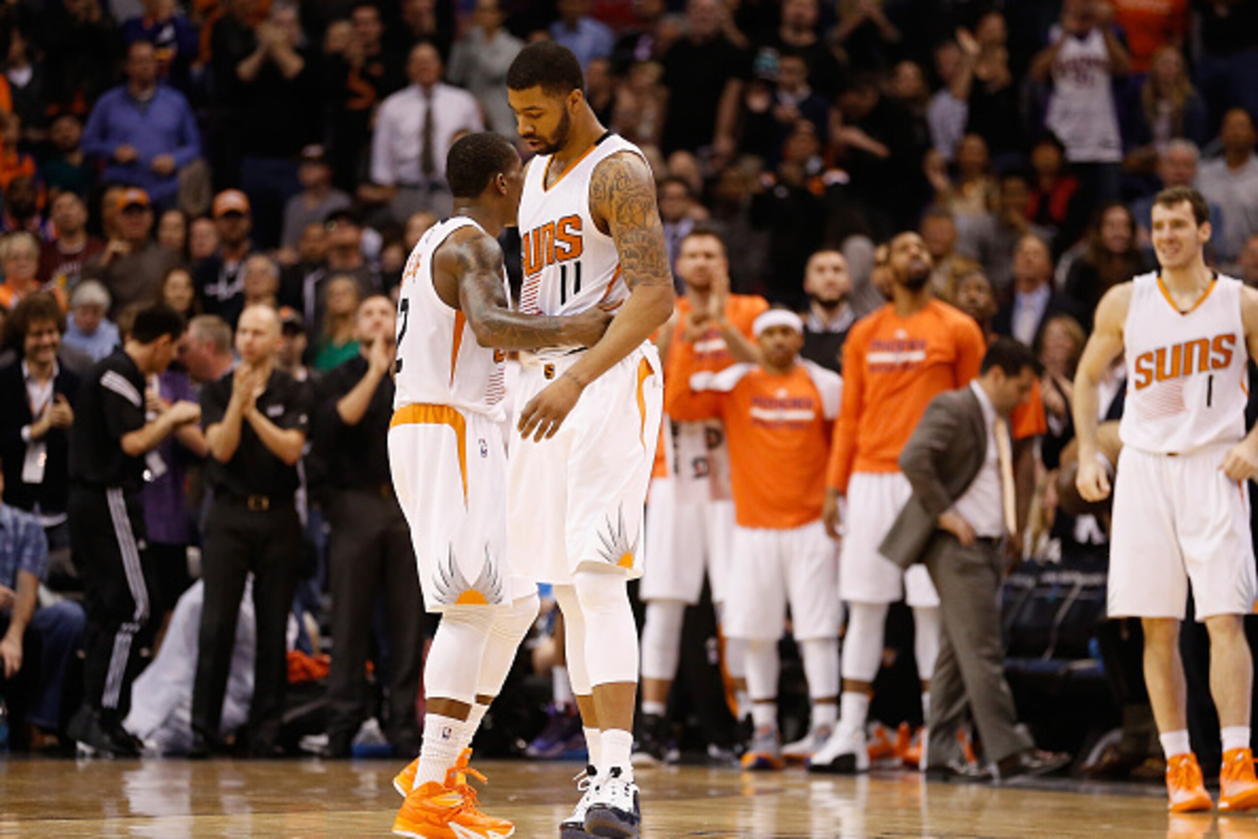 PHOENIX, AZ - JANUARY 13: Markieff Morris #11 of the Phoenix Suns is congratulated by Eric Bledsoe #2 after scoring against the Cleveland Cavaliers during the second half of the NBA game at US Airways Center on January 13, 2015 in Phoenix, Arizona. The PHOENIX, AZ - JANUARY 13: Markieff Morris #11 of the Phoenix Suns is congratulated by Eric Bledsoe #2 after scoring against the Cleveland Cavaliers during the second half of the NBA game at US Airways Center on January 13, 2015 in Phoenix, Arizona. The