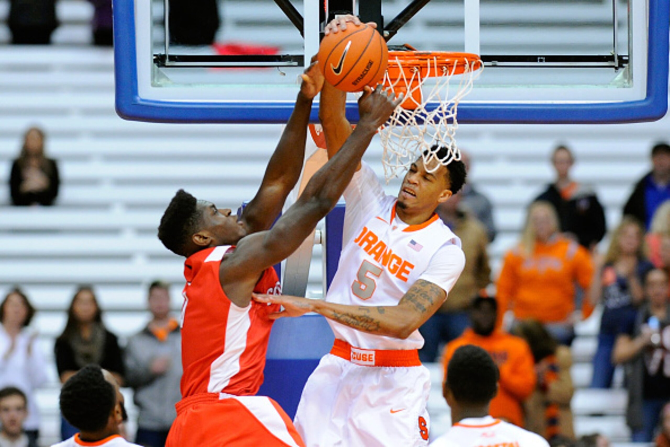 SYRACUSE, NY - DECEMBER 31:  Chris McCullough #5 of the Syracuse Orange blocks the shot of David Onuorah #0 of the Cornell Big Red during the first half at the Carrier Dome on December 31, 2014 in Syracuse, New York.  (Photo by Rich Barnes/Getty Images)