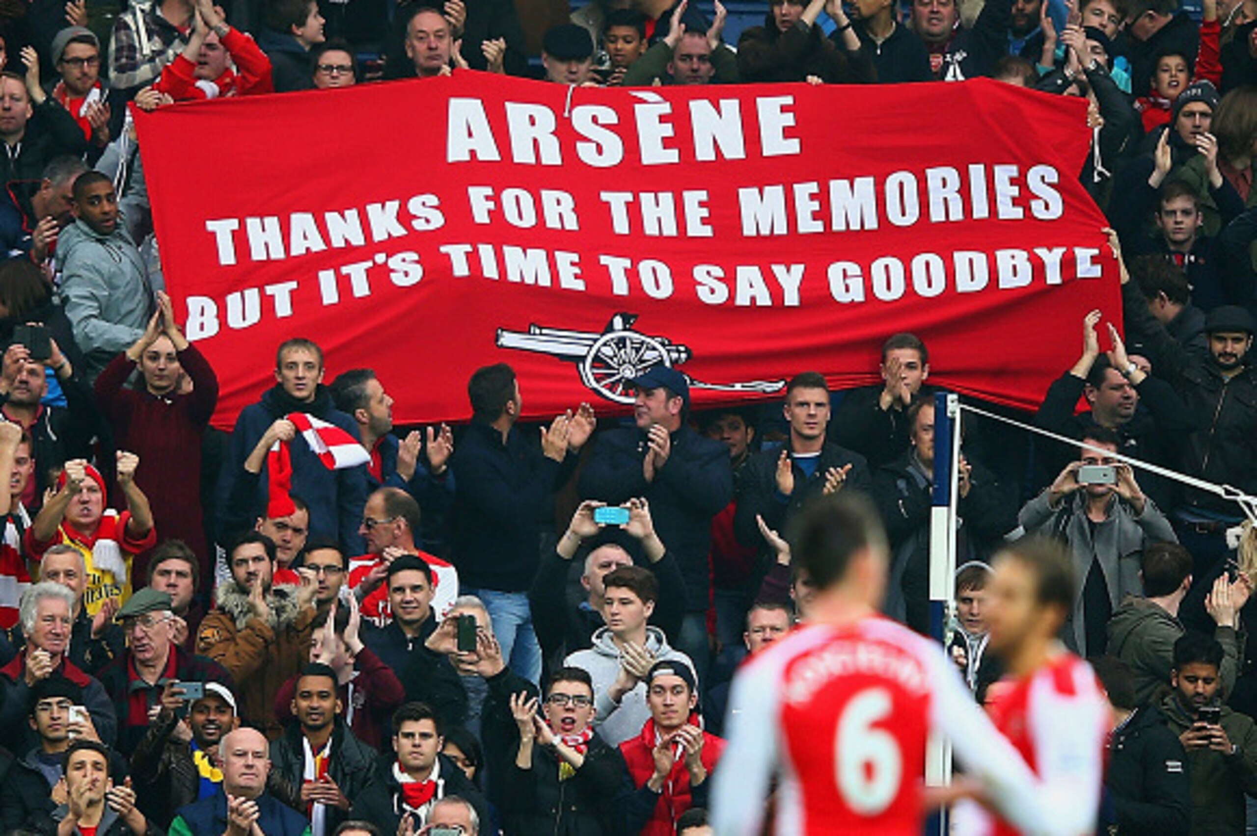 WEST BROMWICH, ENGLAND - NOVEMBER 29:   (EDITORS NOTE: This is a retransmission of image #459708260 with an alternative crop)   Arsenal fans hold up a banner for Arsene Wenger, manager of Arsenal during the Barclays Premier League match between West Bromw