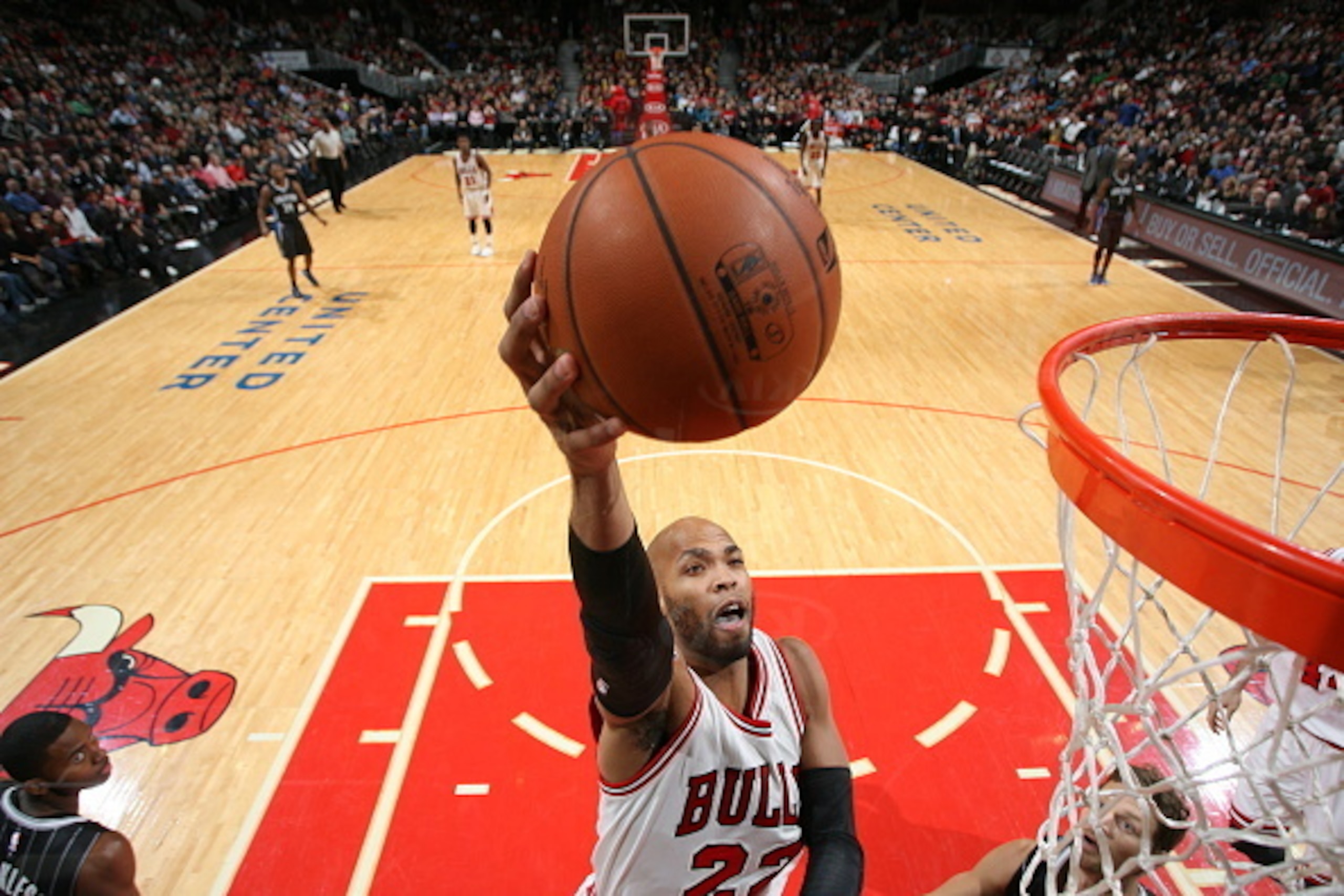 CHICAGO, IL - JANUARY 12:  Taj Gibson #22 of the Chicago Bulls goes to the basket against the Orlando Magic on January 12, 2015 at the United Center in Chicago, Illinois. NOTE TO USER: User expressly acknowledges and agrees that, by downloading and or usi