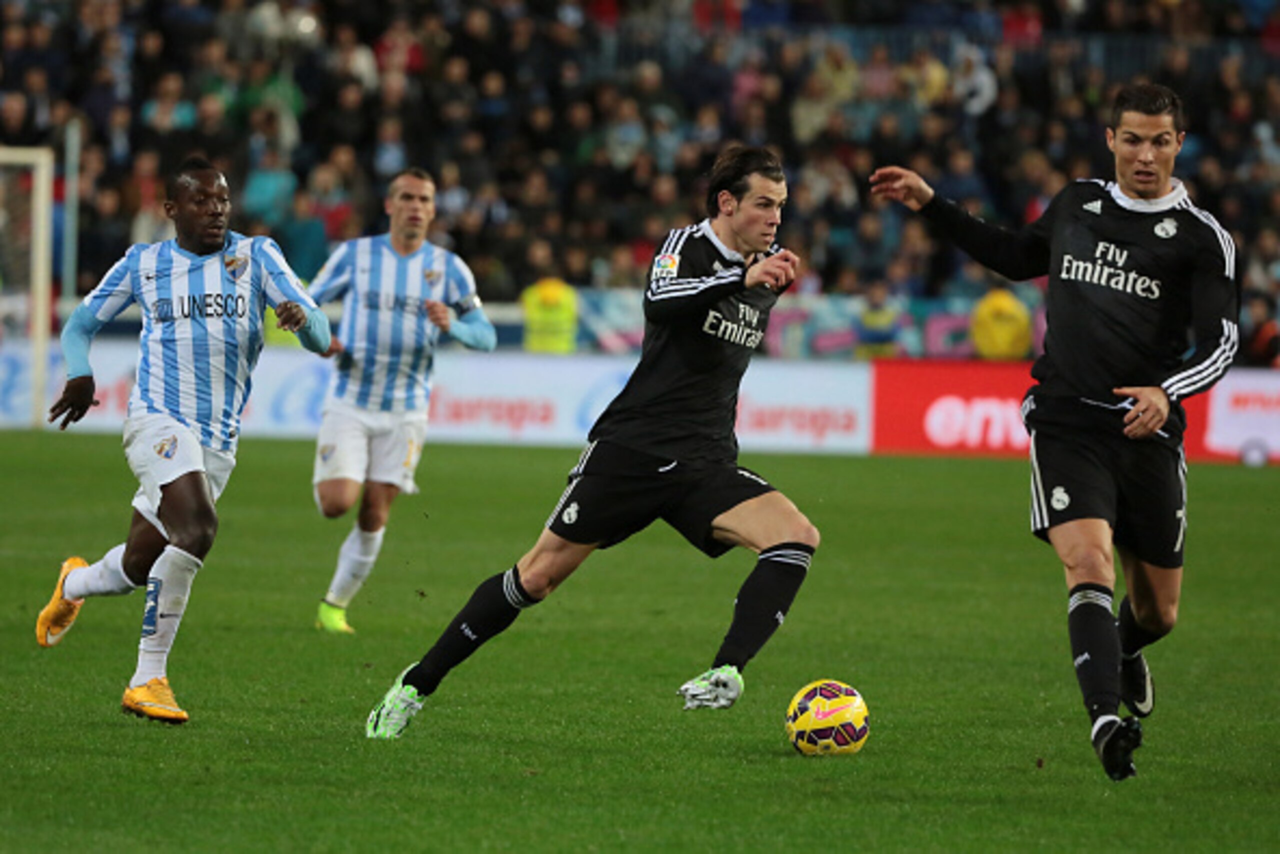 MALAGA, SPAIN - NOVEMBER 29:  Gareth Bale and Cristiano Ronaldo of Real Madrid in action during the La Liga match between Malaga CF and Real Madrid CF at La Rosaleda studium on November 29, 2014 in Malaga, Spain. (Photo by Sergio Camacho/Getty Images)