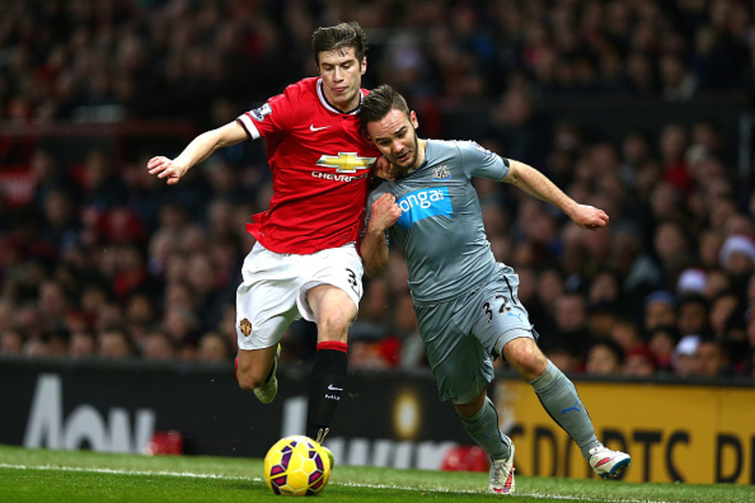 MANCHESTER, ENGLAND - DECEMBER 26:  Patrick McNair of Manchester United competes with Adam Armstrong of Newcastle United during the Barclays Premier League match between Manchester United and Newcastle United at Old Trafford on December 26, 2014 in Manche