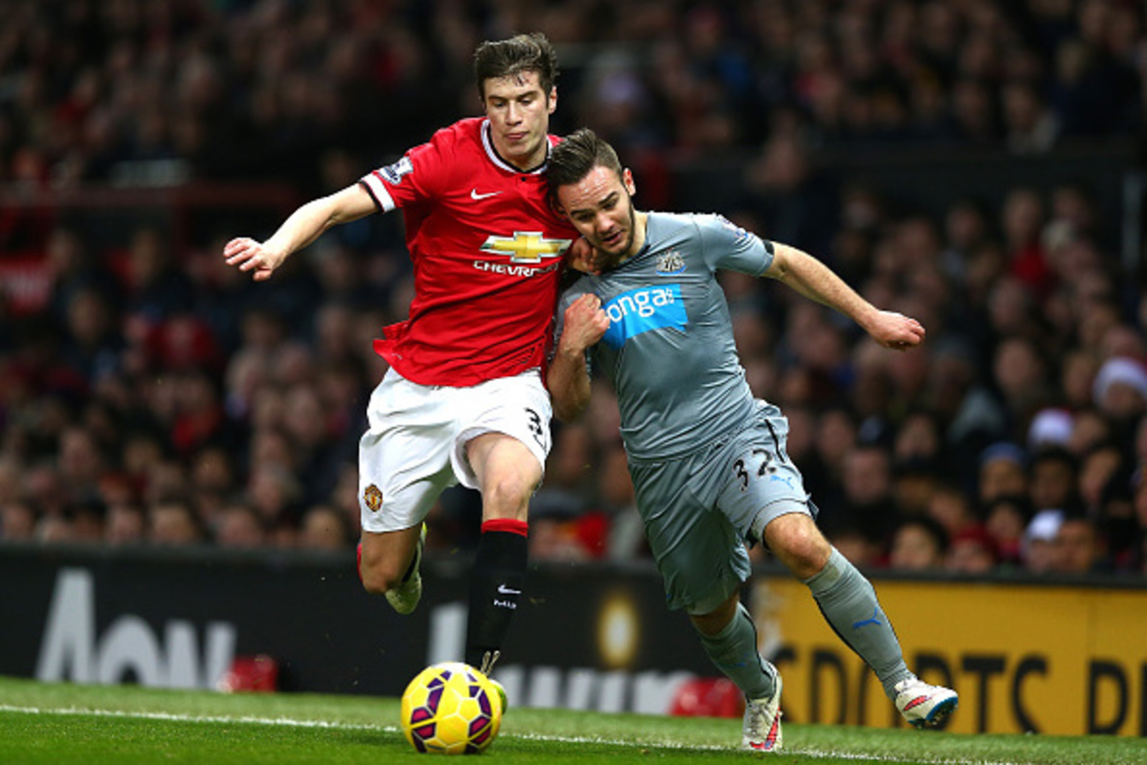 MANCHESTER, ENGLAND - DECEMBER 26:  Patrick McNair of Manchester United competes with Adam Armstrong of Newcastle United during the Barclays Premier League match between Manchester United and Newcastle United at Old Trafford on December 26, 2014 in Manche