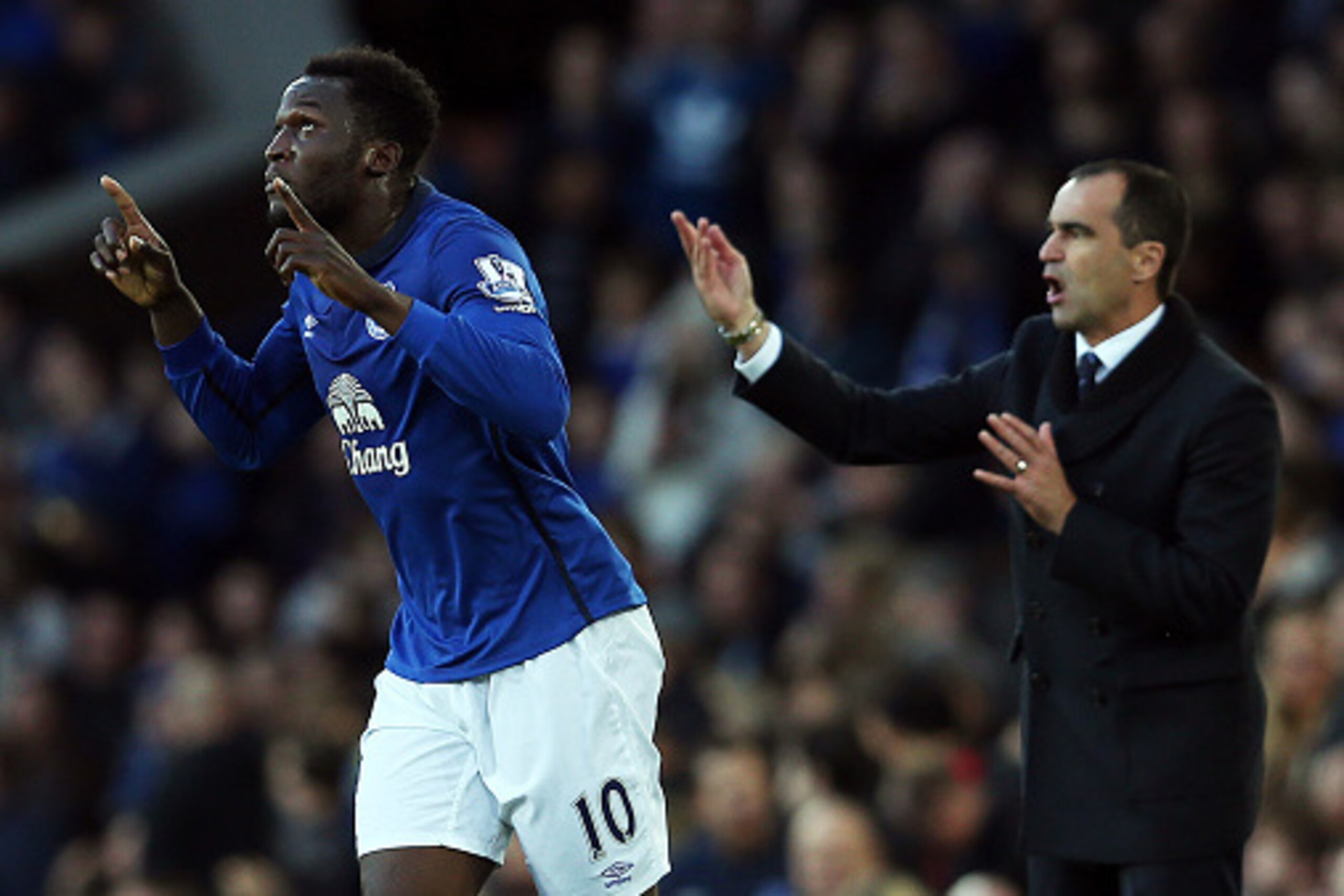 LIVERPOOL, ENGLAND - NOVEMBER 22: Romelu Lukaku of Everton celebrates scoring the opening goal as manager Roberto Martinez issues instructions during the Barclays Premier League match between Everton and West Ham United at Goodison Park on November 22, 20 LIVERPOOL, ENGLAND - NOVEMBER 22: Romelu Lukaku of Everton celebrates scoring the opening goal as manager Roberto Martinez issues instructions during the Barclays Premier League match between Everton and West Ham United at Goodison Park on November 22, 20