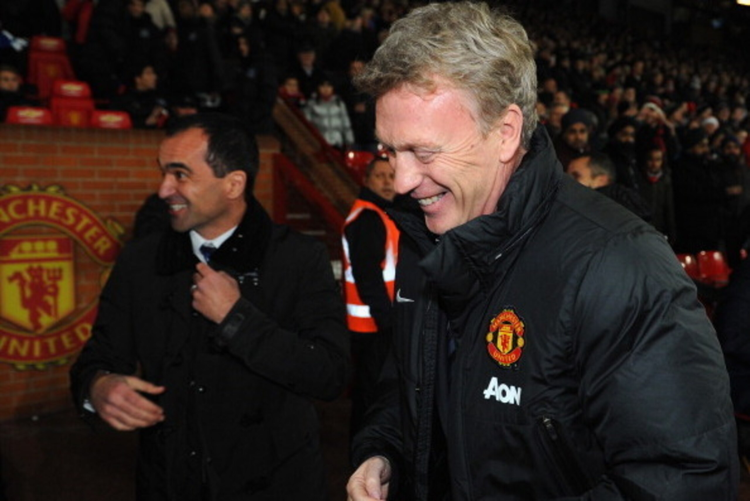 MANCHESTER, ENGLAND - DECEMBER 04: Manchester United Manager David Moyes shares a joke with Everton Manager Roberto Martinez (L) prior to the Barclays Premier League match between Manchester United and Everton at Old Trafford on December 4, 2013 in Manch MANCHESTER, ENGLAND - DECEMBER 04: Manchester United Manager David Moyes shares a joke with Everton Manager Roberto Martinez (L) prior to the Barclays Premier League match between Manchester United and Everton at Old Trafford on December 4, 2013 in Manch