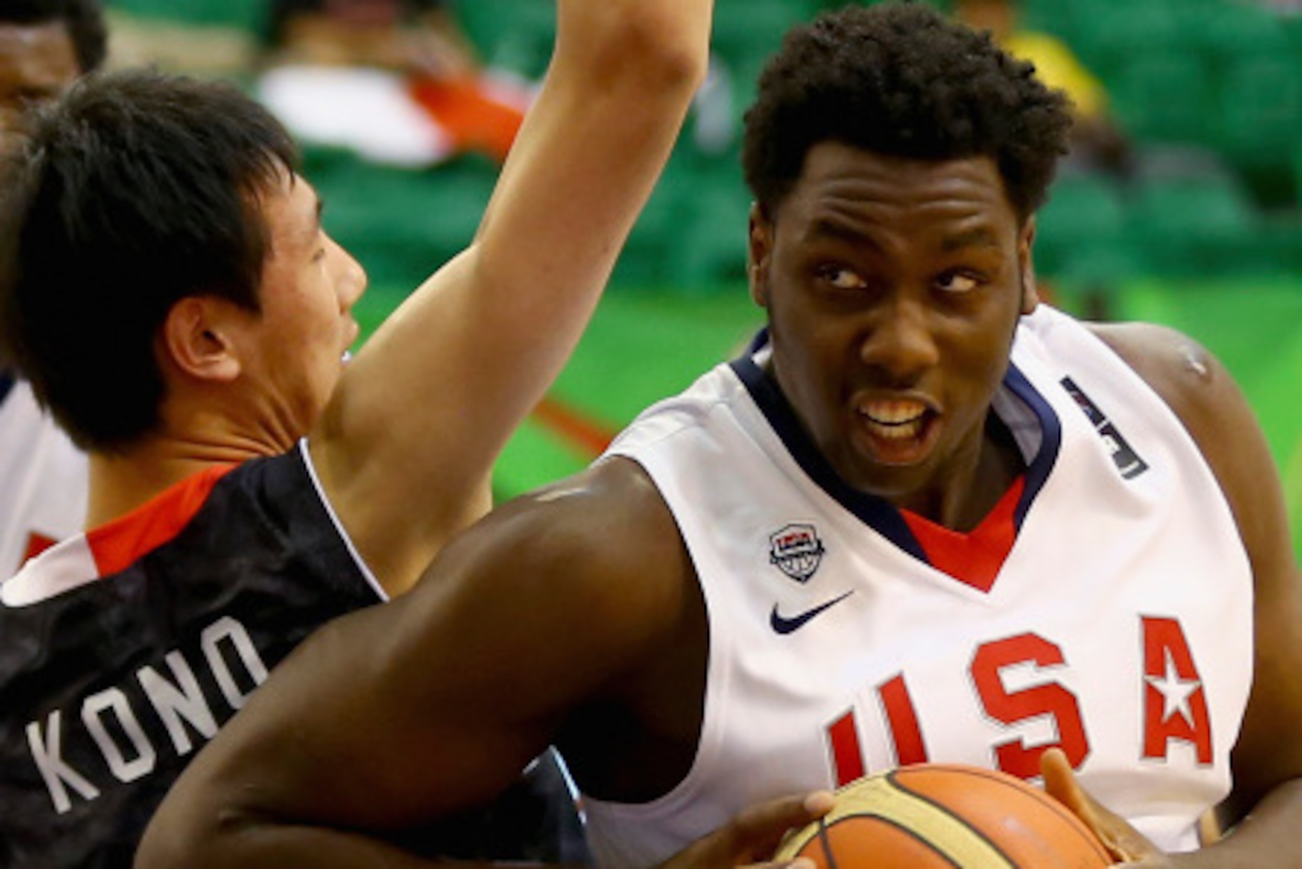 DUBAI, UNITED ARAB EMIRATES - AUGUST 12:  Caleb Swanigan of the United States drives the ball against Yuta Kono of Japan during the FIBA U17 World Championships Group Match between Japan and United States of America at Al Shabab Club on August 12, 2014 in
