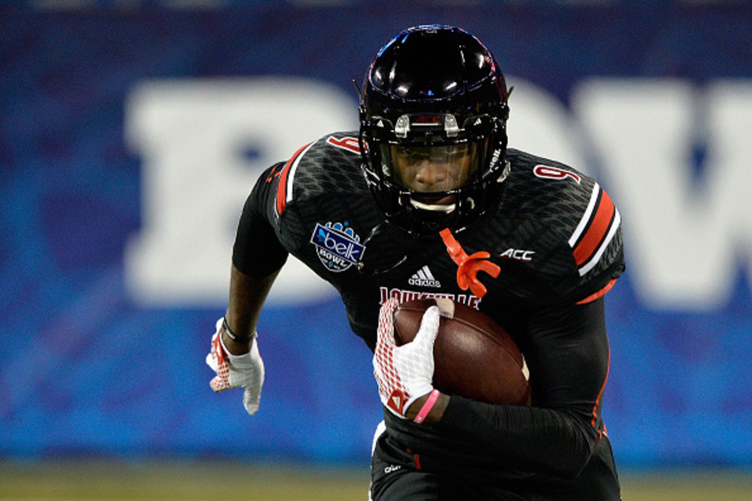 CHARLOTTE, NC - DECEMBER 30:  DeVante Parker #9 of the Louisville Cardinals warms up before the Belk Bowl against the Georgia Bulldogs at Bank of America Stadium on December 30, 2014 in Charlotte, North Carolina.  (Photo by Grant Halverson/Getty Images)