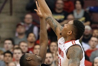 COLUMBUS, OH - JANUARY 13:  Amir Williams #23 of the Ohio State Buckeyes blocks a shot from Caris LeVert #23 of the Michigan Wolverines in the second half on January 13, 2015 at Value City Arena in Columbus, Ohio. Ohio State defeated Michigan 71-52.  (Pho