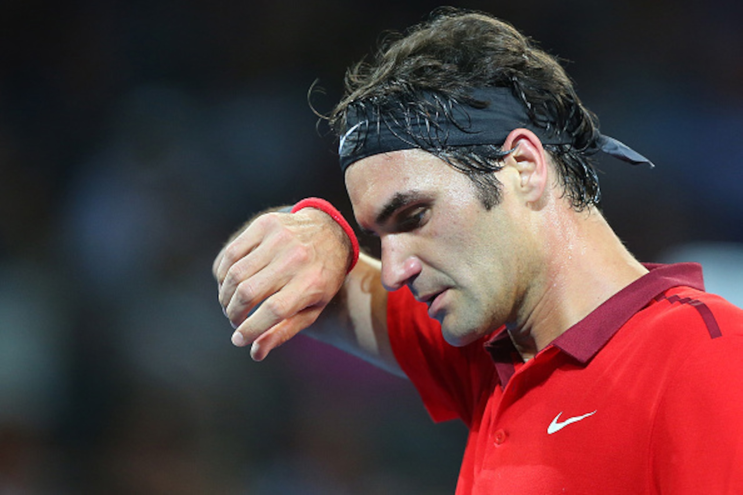 BRISBANE, AUSTRALIA - JANUARY 08:  Roger Federer of Switzerland looks on in his match against John Millman of Australia during day five of the 2015 Brisbane International at Pat Rafter Arena on January 8, 2015 in Brisbane, Australia.  (Photo by Chris Hyde