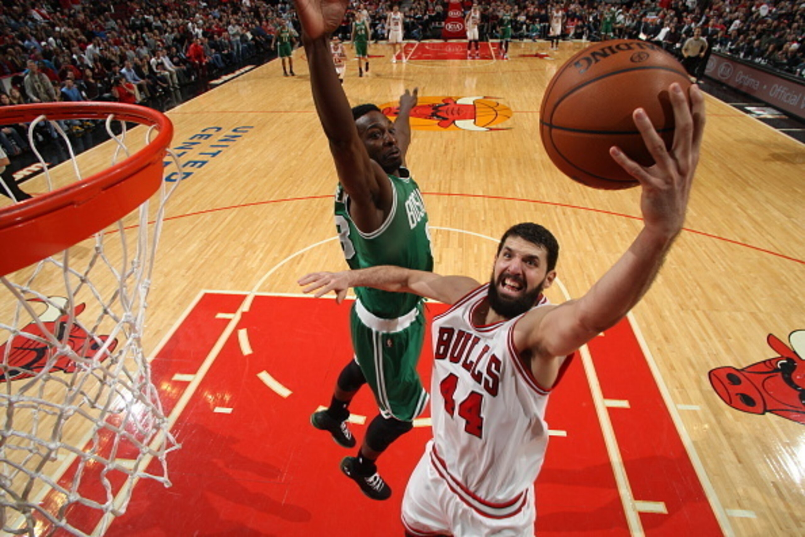 CHICAGO, IL - JANUARY 3: Nikola Mirotic #44 of the Chicago Bulls goes up for a shot against the Boston Celtics on January 3, 2015 at the United Center in Chicago, Illinois. NOTE TO USER: User expressly acknowledges and agrees that, by downloading and or u