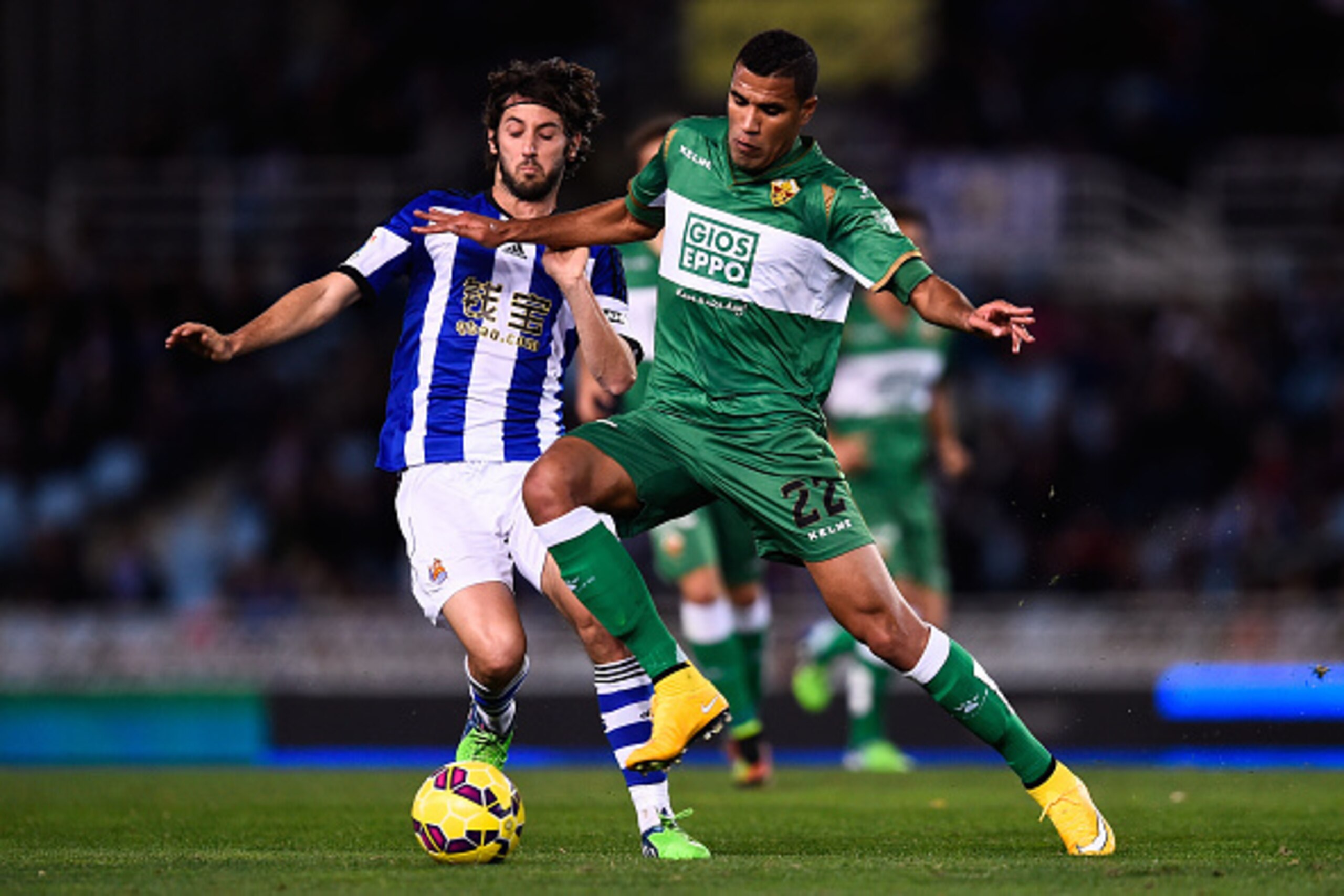 SAN SEBASTIAN, SPAIN - NOVEMBER 28:  Esteban Granero of Real Sociedad competes for the ball with Jonathas Cristian de Jesus of Elche FC during the La Liga match between Real Socided and Elche FC at Estadio Anoeta on November 28, 2014 in San Sebastian, Spa