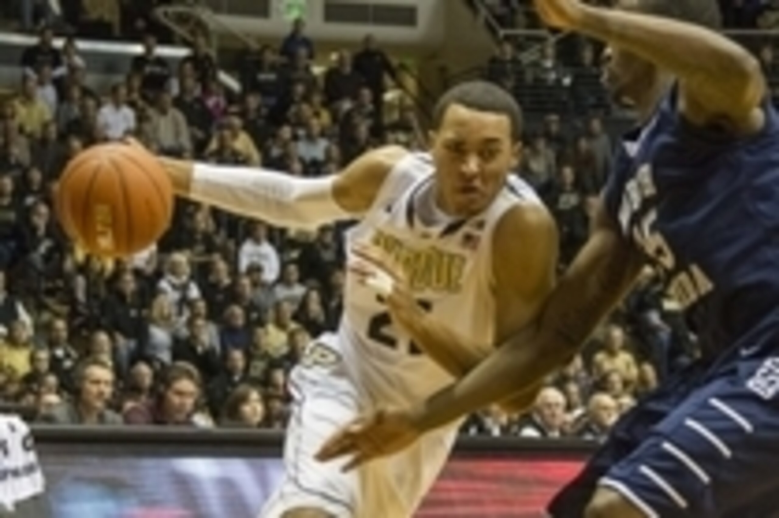 Dec 6, 2014; West Lafayette, IN, USA; Purdue Boilermakers guard Kendall Stephens (21) dribbles the ball in on North Florida Ospreys forward Chris Davenport (35) in the second half of the game at Mackey Arena. The North Florida Ospreys beat the Purdue Boil