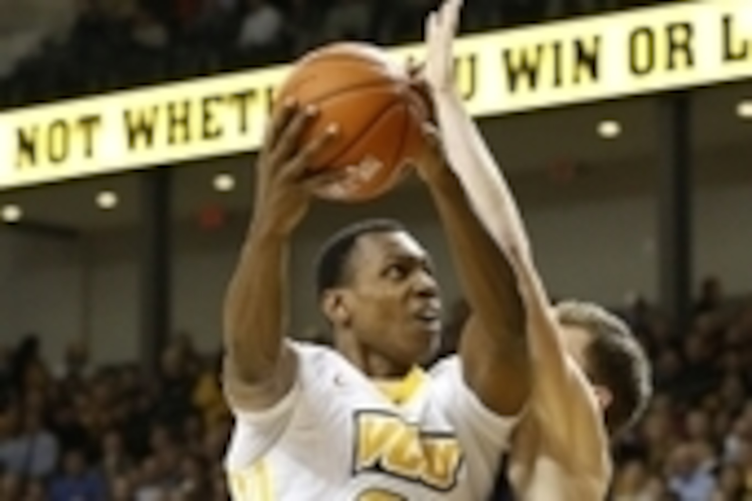 Dec 16, 2014; Richmond, VA, USA; Virginia Commonwealth Rams guard/forward Treveon Graham (21) shoots the ball as Belmont Bruins guard Evan Bradds (35) defends in the second half at Stuart Siegel Center. The Rams won 78-51. Mandatory Credit: Geoff Burke-US
