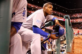 ST LOUIS, MO - OCTOBER 07:  Yasiel Puig #66 of the Los Angeles Dodgers looks on from the dugout steps after being defeated by the St. Louis Cardinals in Game Four of the National League Divison Series at Busch Stadium on October 7, 2014 in St Louis, Misso