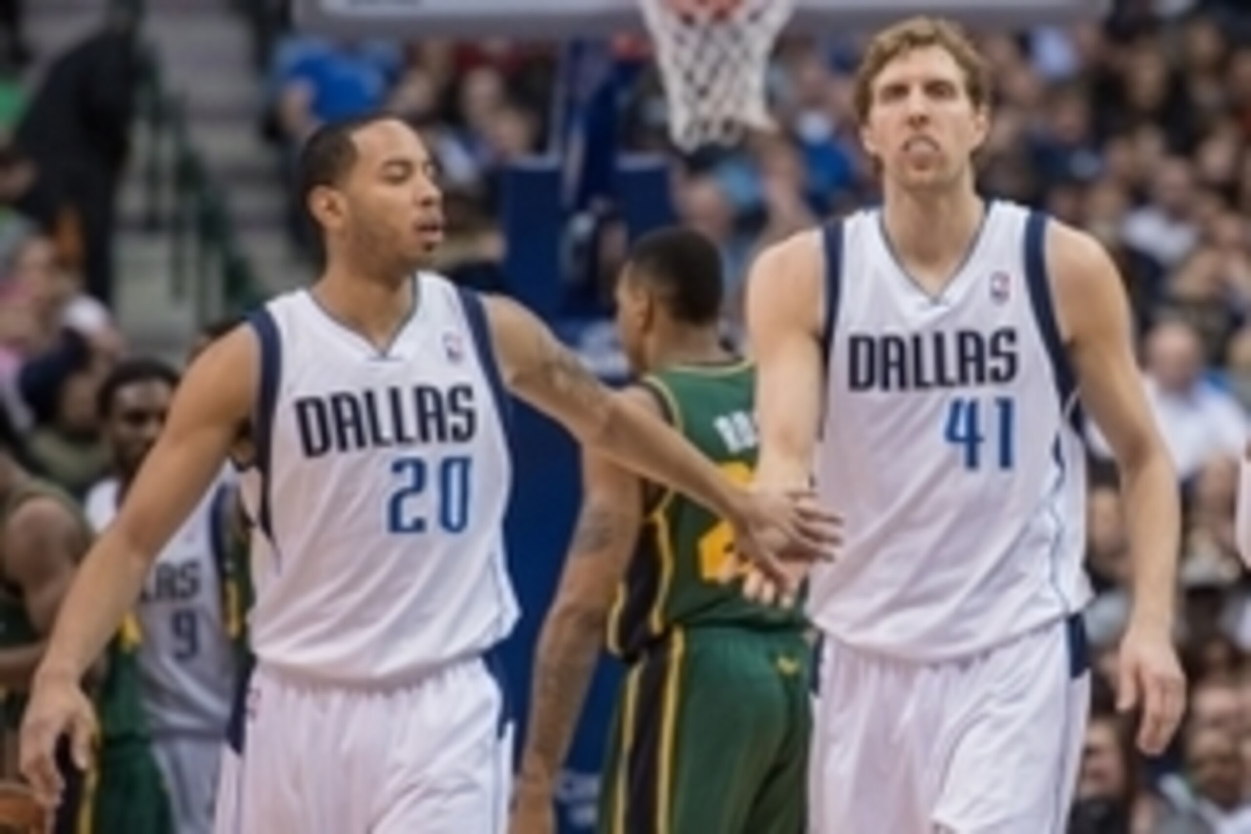 Feb 7, 2014; Dallas, TX, USA; Dallas Mavericks point guard Devin Harris (20) congratulates power forward Dirk Nowitzki (41) during the first half at American Airlines Center. The Mavericks won 103-81. Mandatory Credit: Jerome Miron-USA TODAY Sports